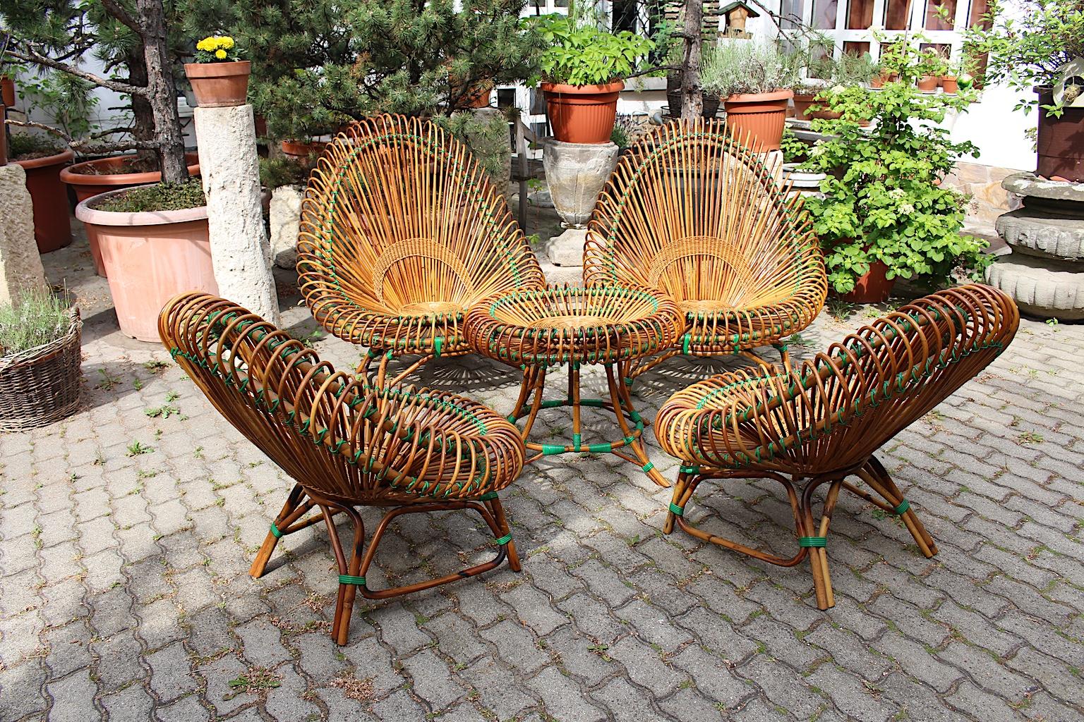 A Mid-Century Modern rattan garden furniture set by Janine Abraham and Dirk Jan Rol, which is very rare and shows a complete set. The living room set consists of four rattan lounge chairs in two different sizes, maybe for gents and ladies, and one