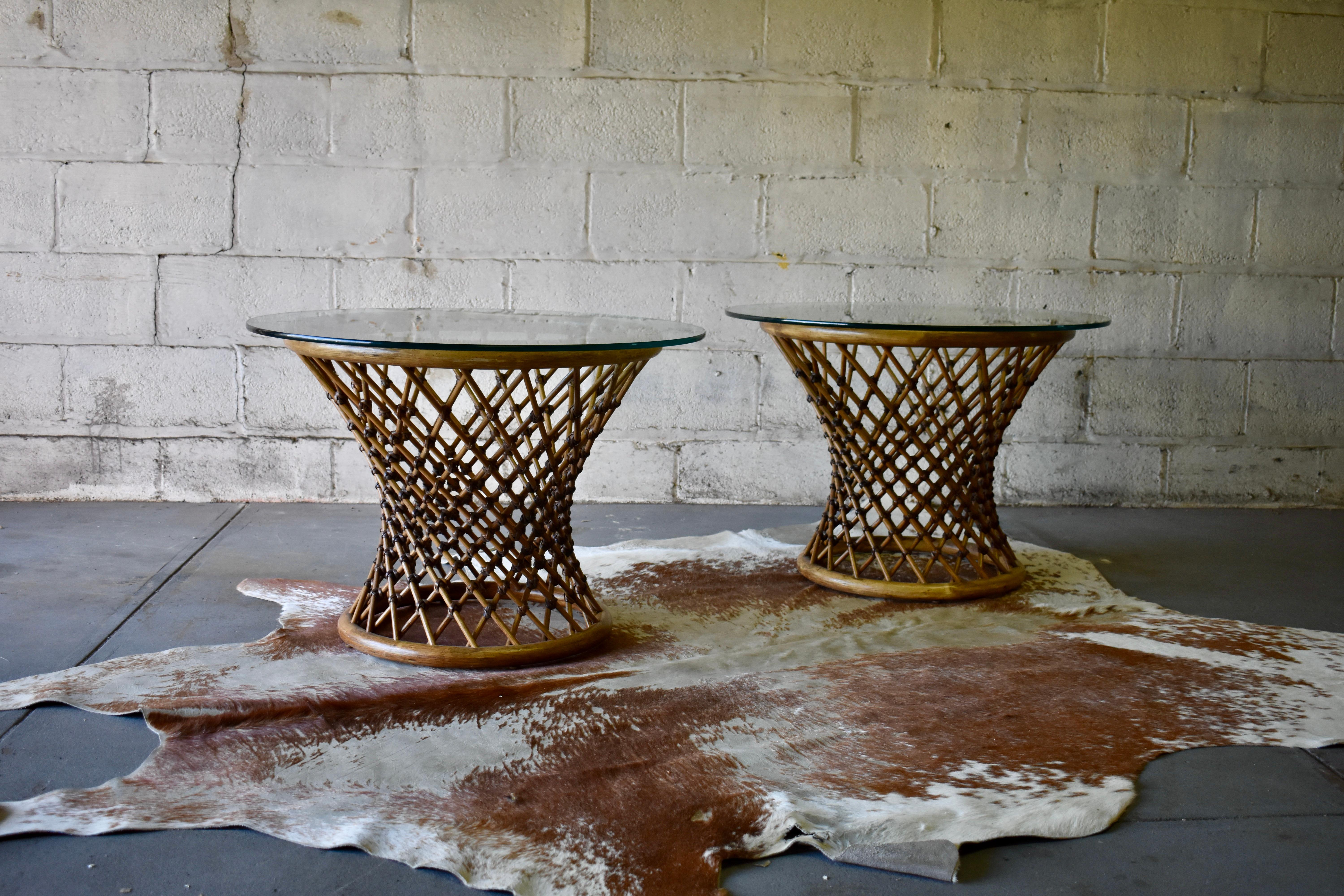 Mid Century Modern Rattan + Glass side tables / end tables. These stunning corseted tables will easily become the focal point of your living room. Tremendous design detailing and large glass surface areas, perfect for placement of table lamps, books