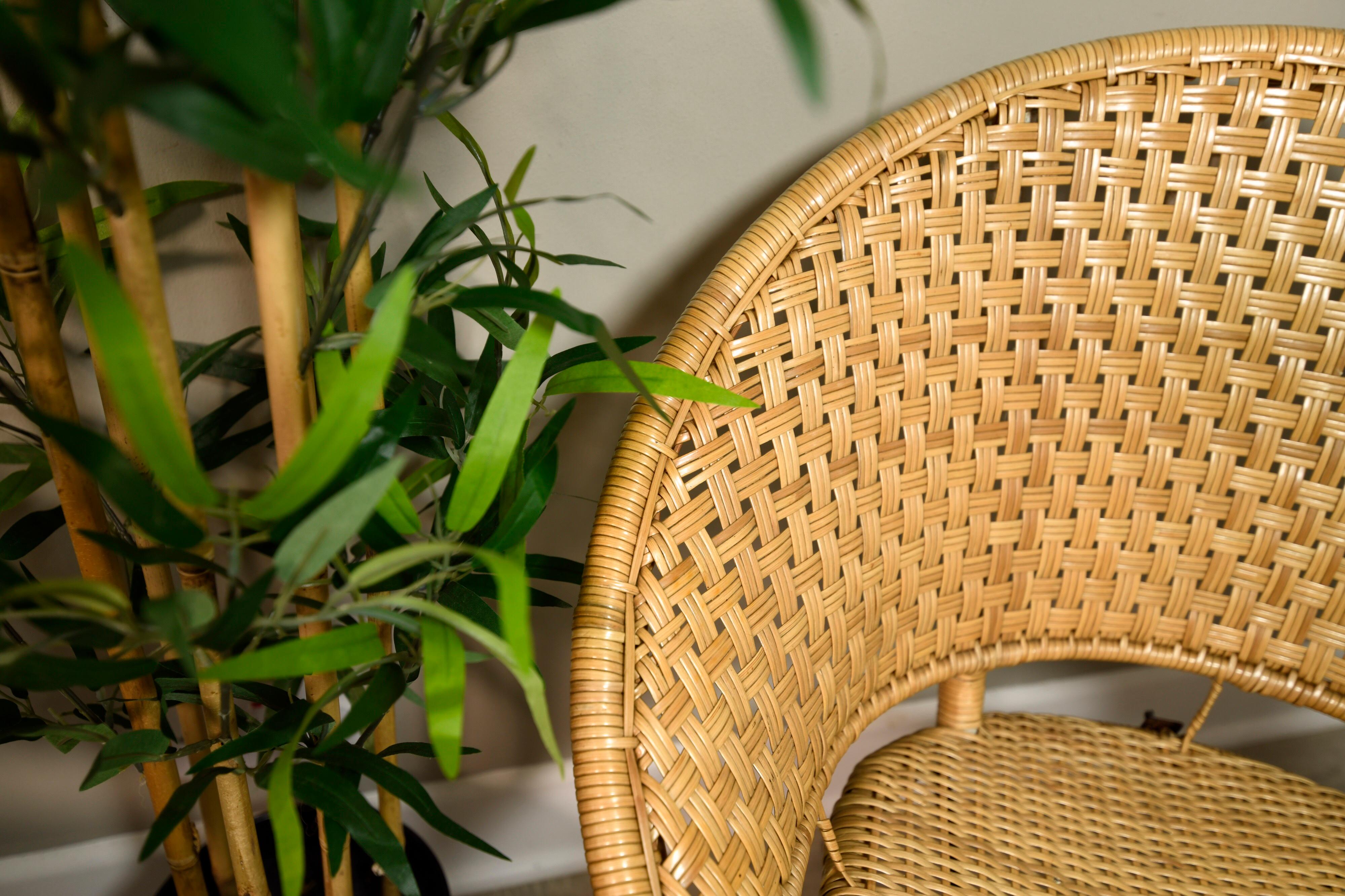 This circle chair dated to the 1960s. This will bring a jaunty air to your patio, living room or sun room. Woven wicker or rattan with a film coating for protection hoop seats; iron frames.