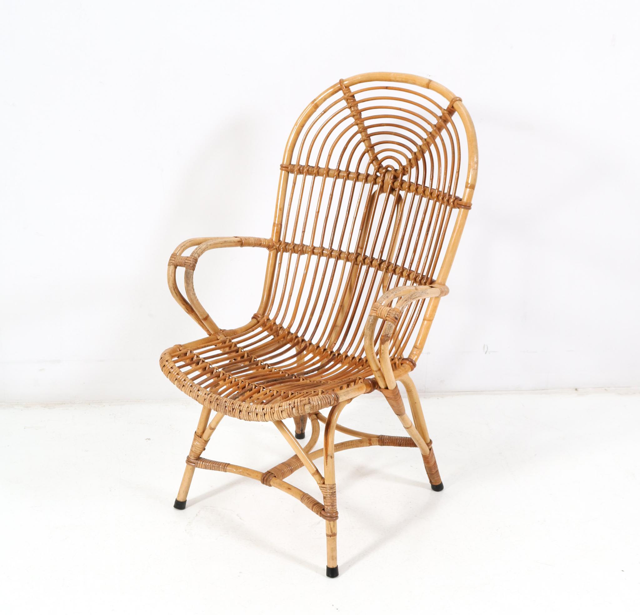 Amazing and rare Mid-Century Modern lounge chair.
Design in the style of Franco Albini.
Striking Italian design from the 1960s.
Rattan and natural bamboo frame.
The sheepskin rug is for decoration, so not for sale!
This wonderful Mid-Century Modern