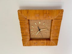Mid century modern rattan wall clock by Raymor, circa 1960s.