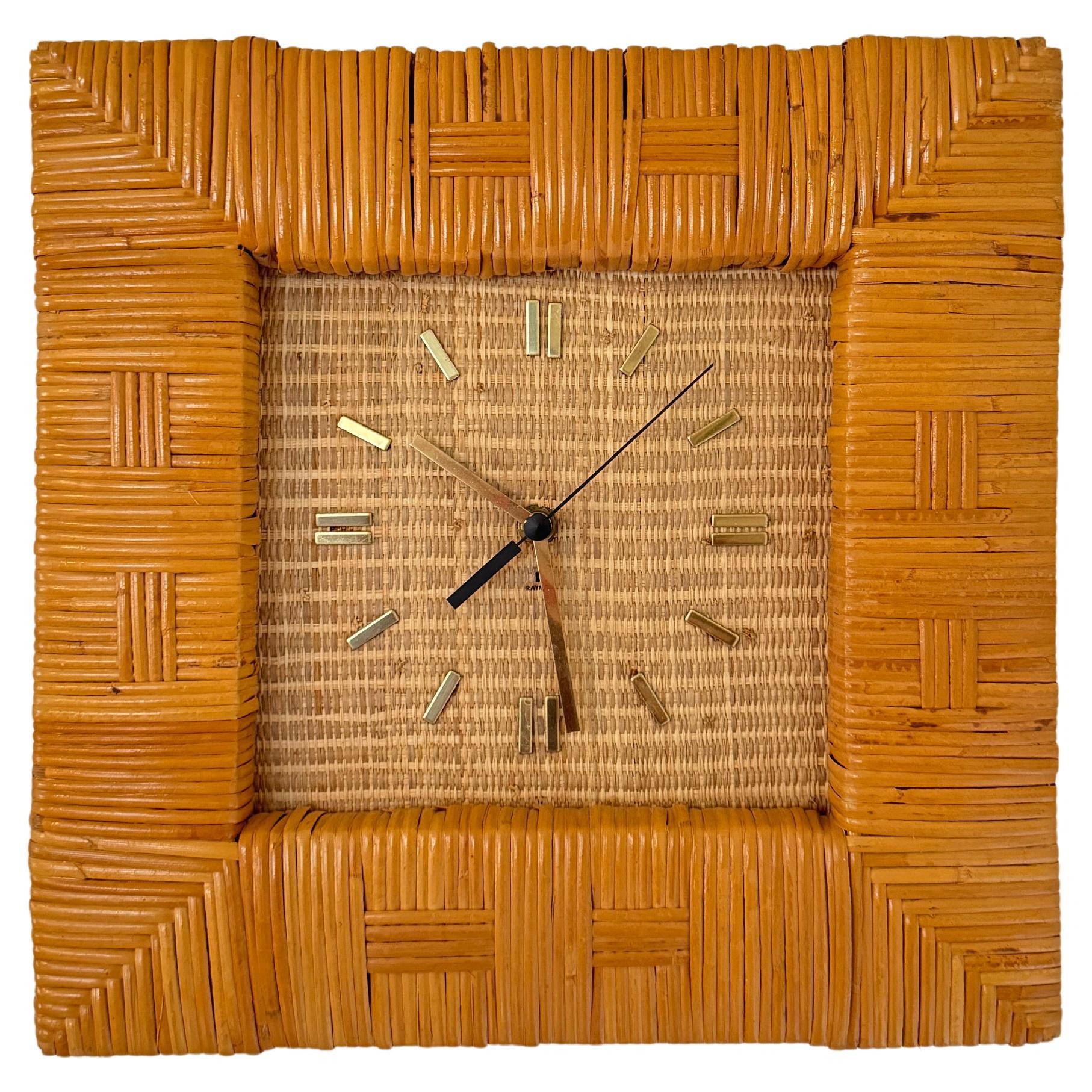 Mid century modern rattan wall clock by Raymor, circa 1960s.  For Sale
