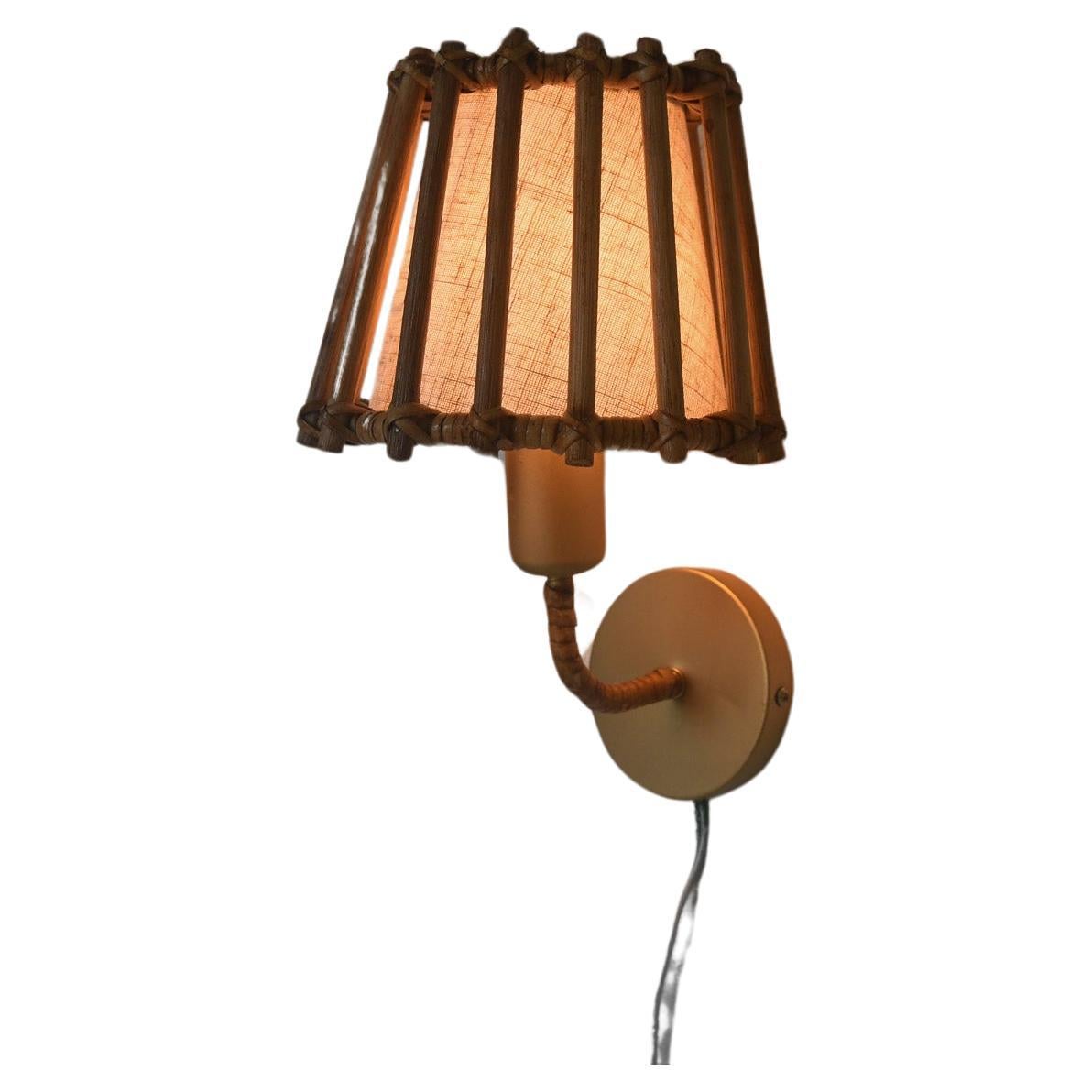 Mid century modern wall scones, This charming Organic rattan wall mounted sconce lamp is designed to bring a touch of mid-century French elegance to any room. Crafted from Rattan, with golden metal frame its distinctive rattan framed shade that