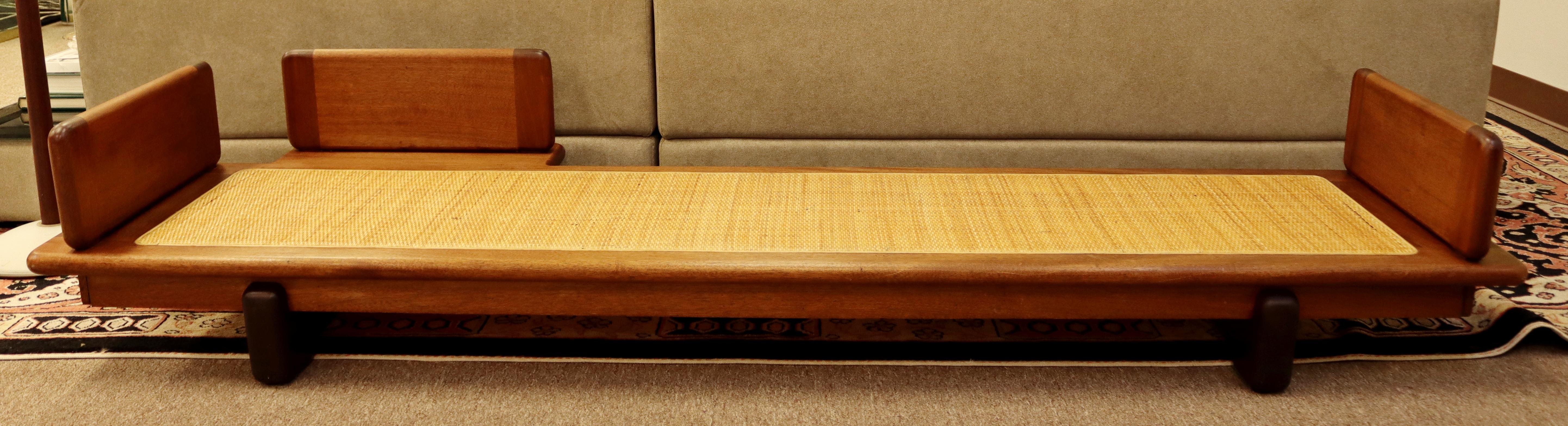 For your consideration is a lovely and long, low bench, made of wood and with a rattan seat, by an artist from Cranbrook, circa the 1960s. In excellent vintage condition. The dimensions are 82