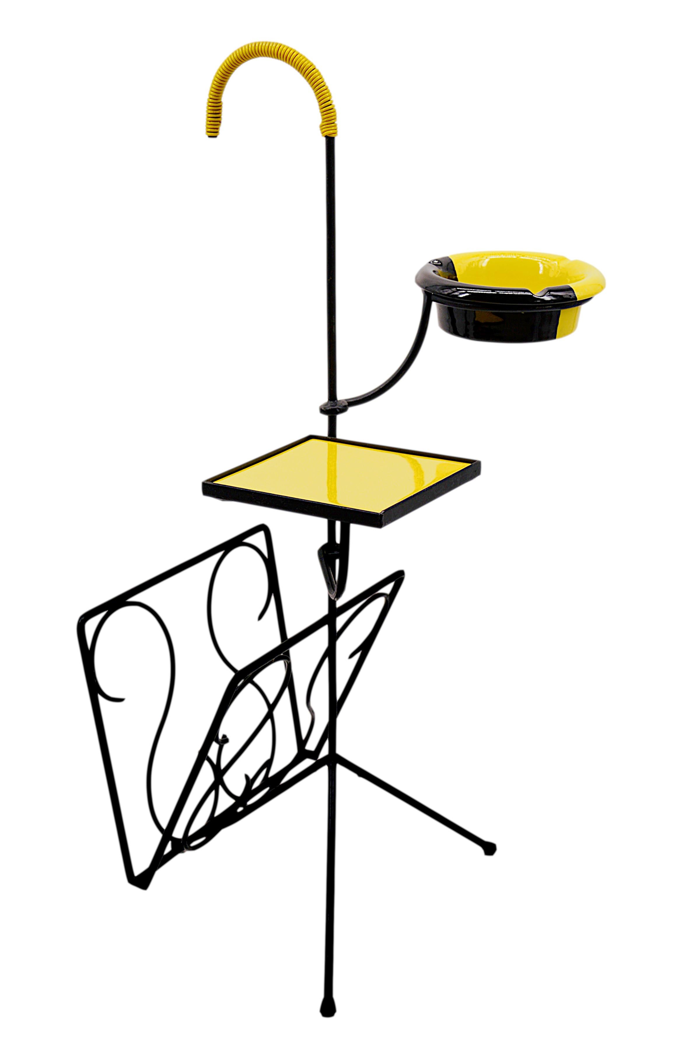 French Mid-Century Modern Reading Table with Magazine Rack, 1950s, France. This elegant French mid-century modern reading table combines simplicity and functionality with a slender yet sturdy metal base. The table features a small ceramic tray,