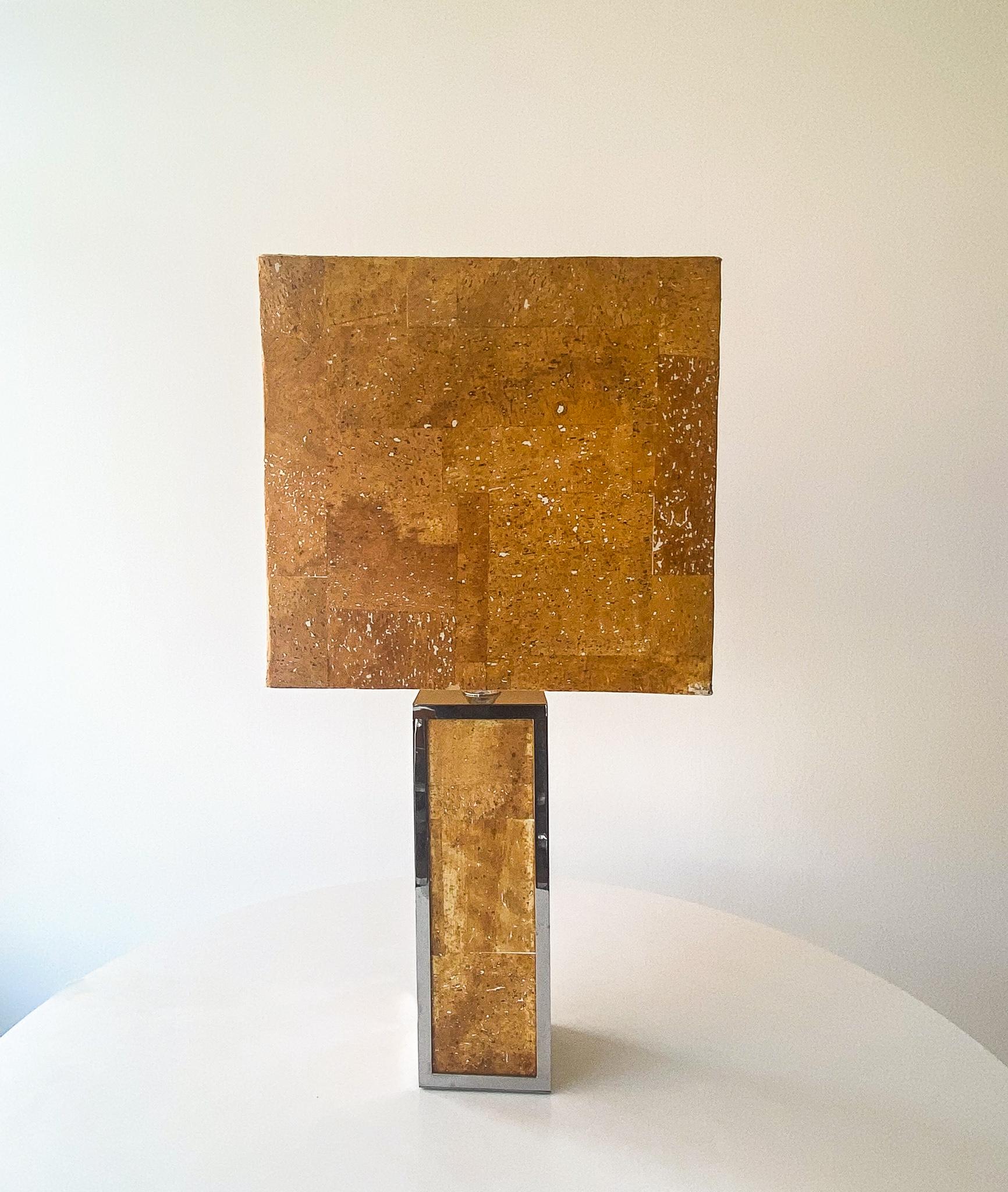 Mid-Century Modern rectangular cork chrome table lamp, Italy 1970s.

One of a kind Italian table lamp completely made of cork with some chrome elements on the base. This rare table lamp of the 70s consists of a large rectangular lampshade which is
