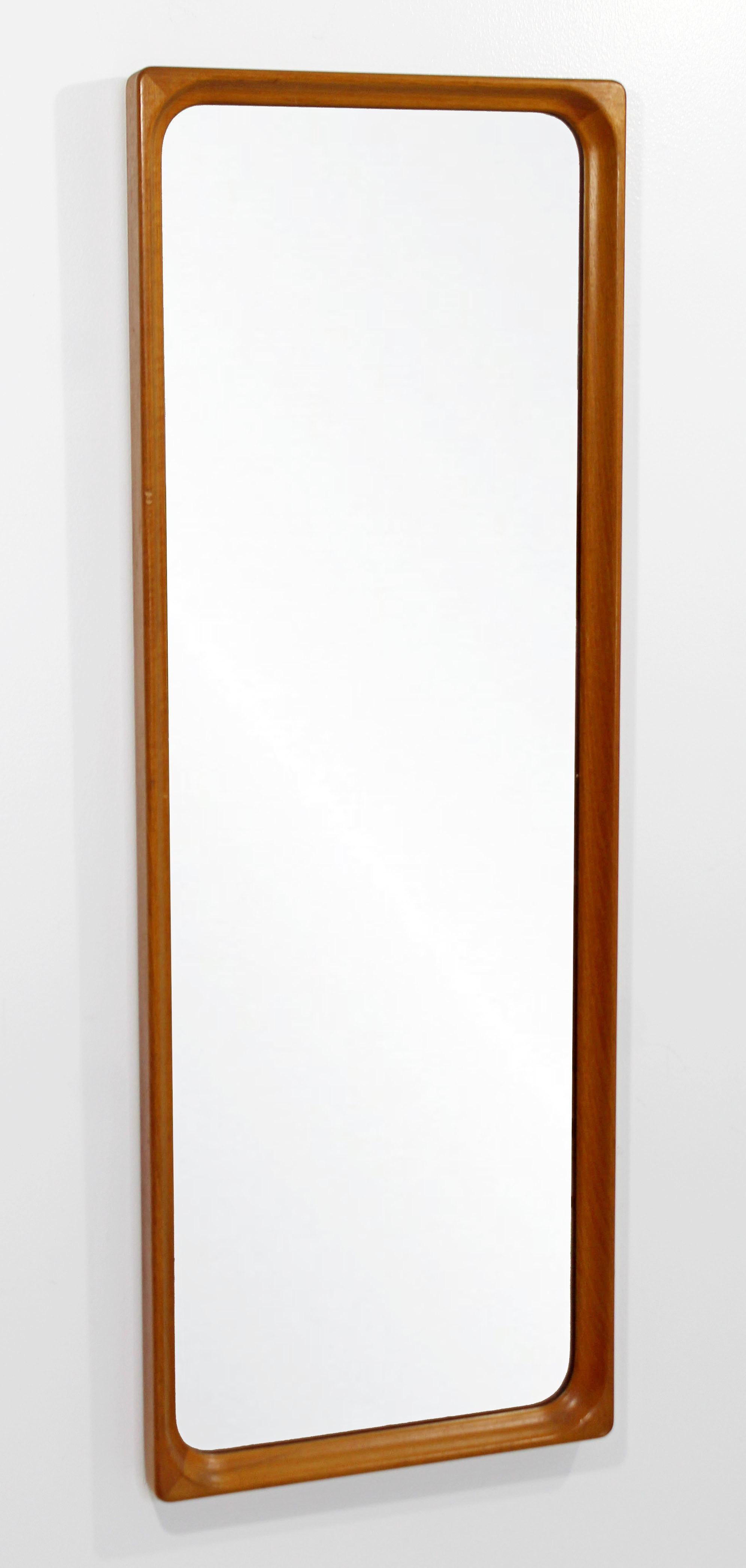For your consideration is a gorgeous, rectangular, hanging wall mirror, by Markaryd Glas Master, Sweden, circa the 1950s-1960s. In excellent condition, despite a small mark in the wood. The dimensions are 15