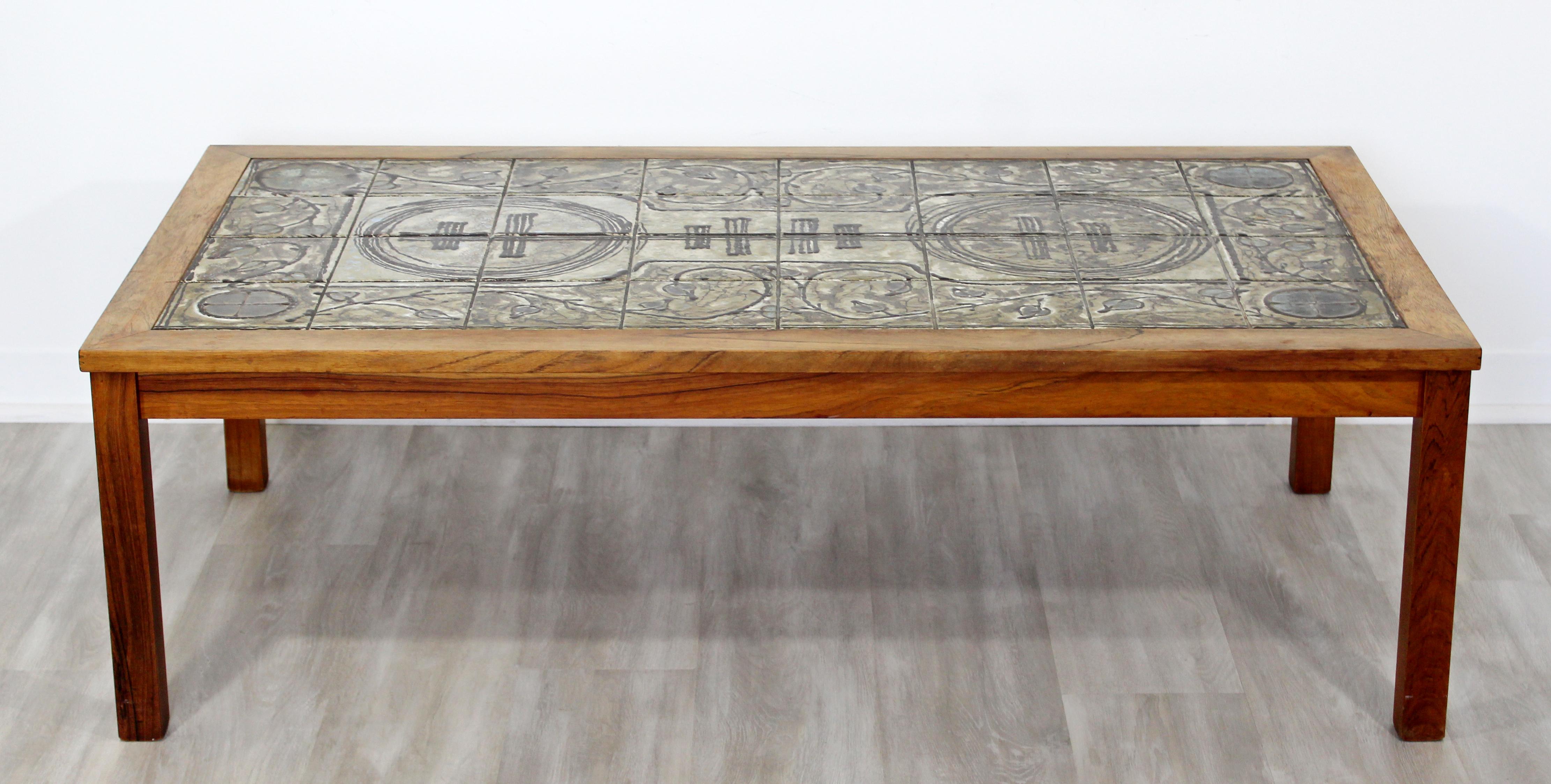 For your consideration is an incredible, wood coffee table, with tile design on the top, made by Trigh in Denmark, circa 1960s. In excellent condition. The dimensions are 53