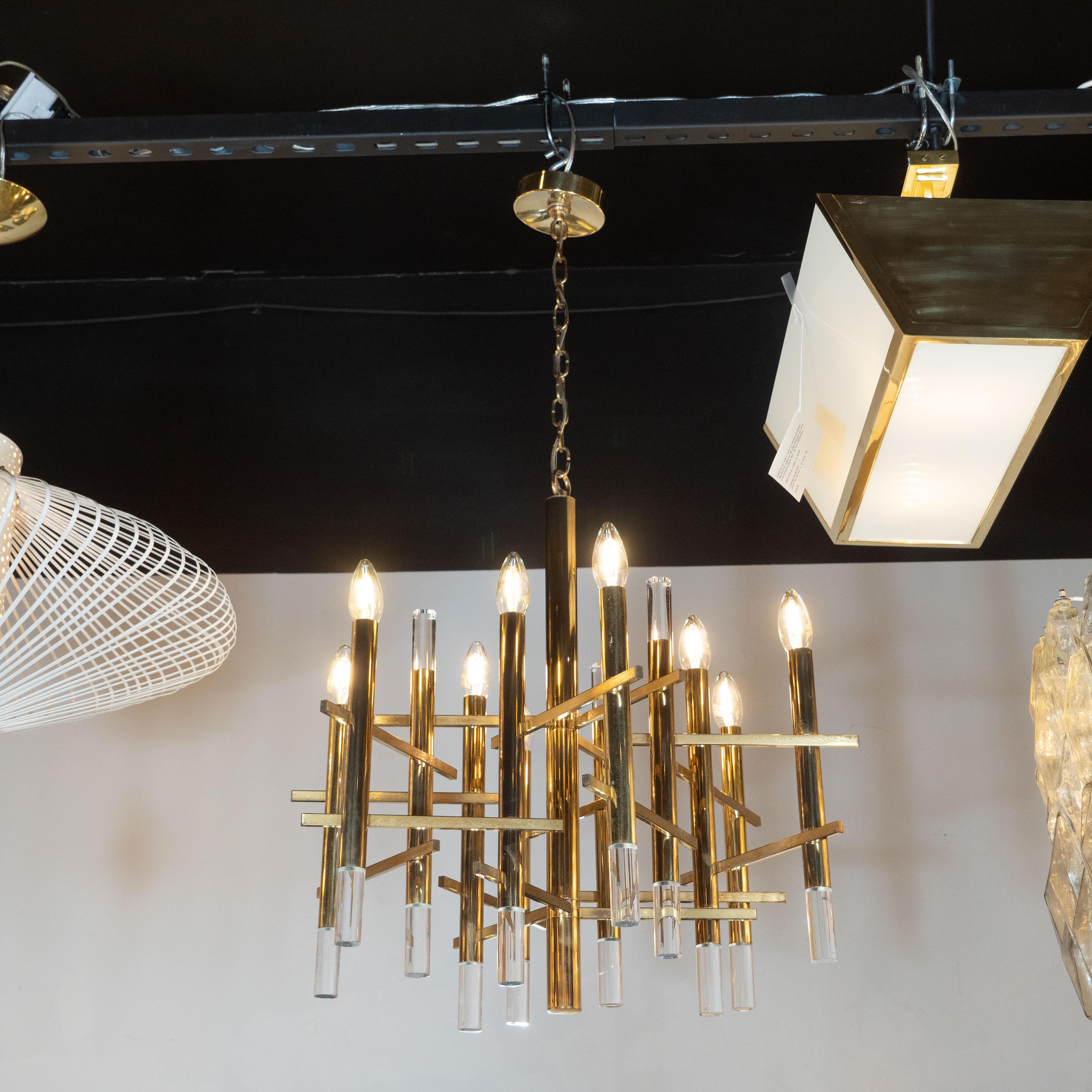 This refined rectilinear chandelier was realized by Gaetano Sciolari in Italy, circa 1970. It features a cylindrical body with six arms of the same form attached via rectangular slats to create a dynamic basket weave pattern in alternating segments
