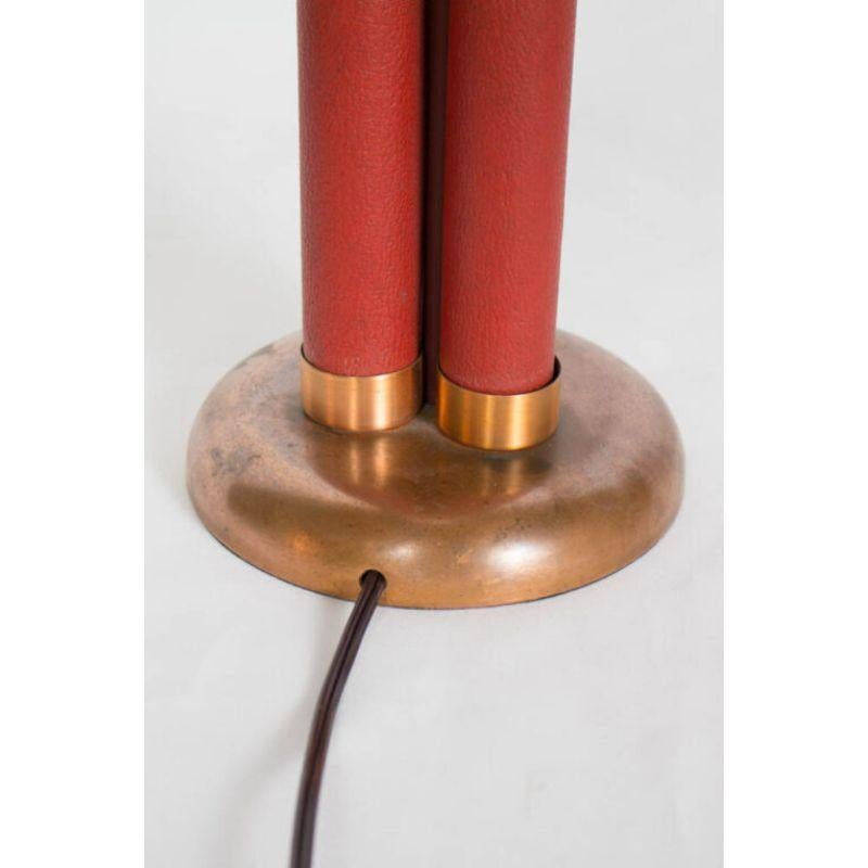 Red Leather Bound like sticks of Dynamite! Copper plated base and end pieces. These lamps were part of a lot of lamps we purchased from a collector. They have the original tags: New old stock lamps. They were hidden for 60 years in storage, and have