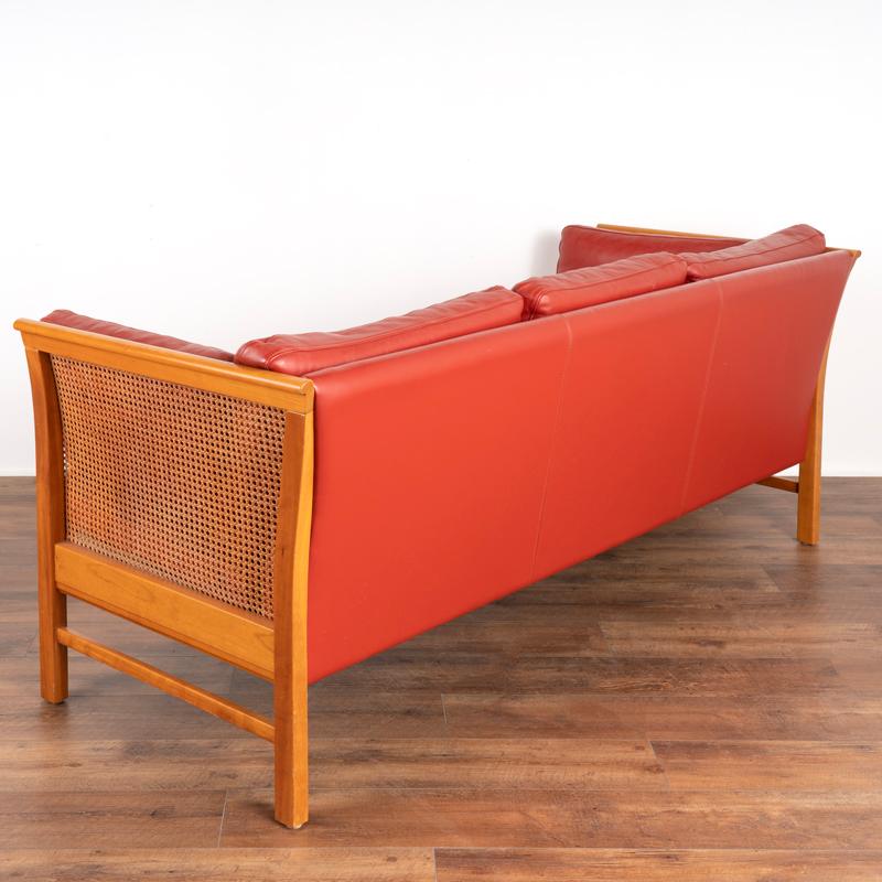 Danish Mid Century Modern Red Leather Three Seat Sofa With Rattan Sides from Denmark For Sale