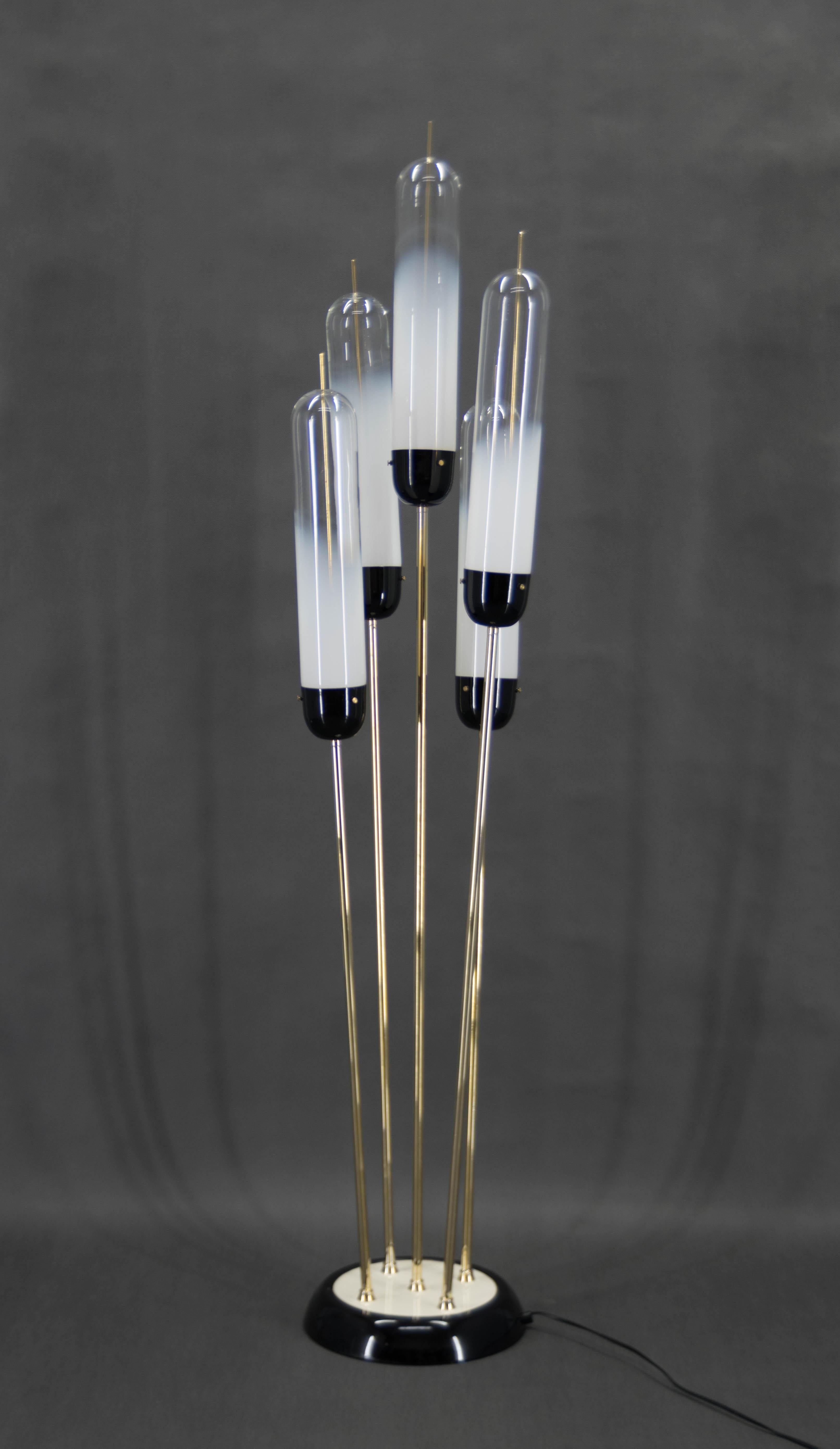 Mid-Century Modern Space Age Brass Reed floor lamp, blown white smoke murano glass tube shades by the Italian design manufacture Mazzega. 
Very good condition.
8x40W, E12-E14 bulbs
US plug adapter included
Shipping quote on request.