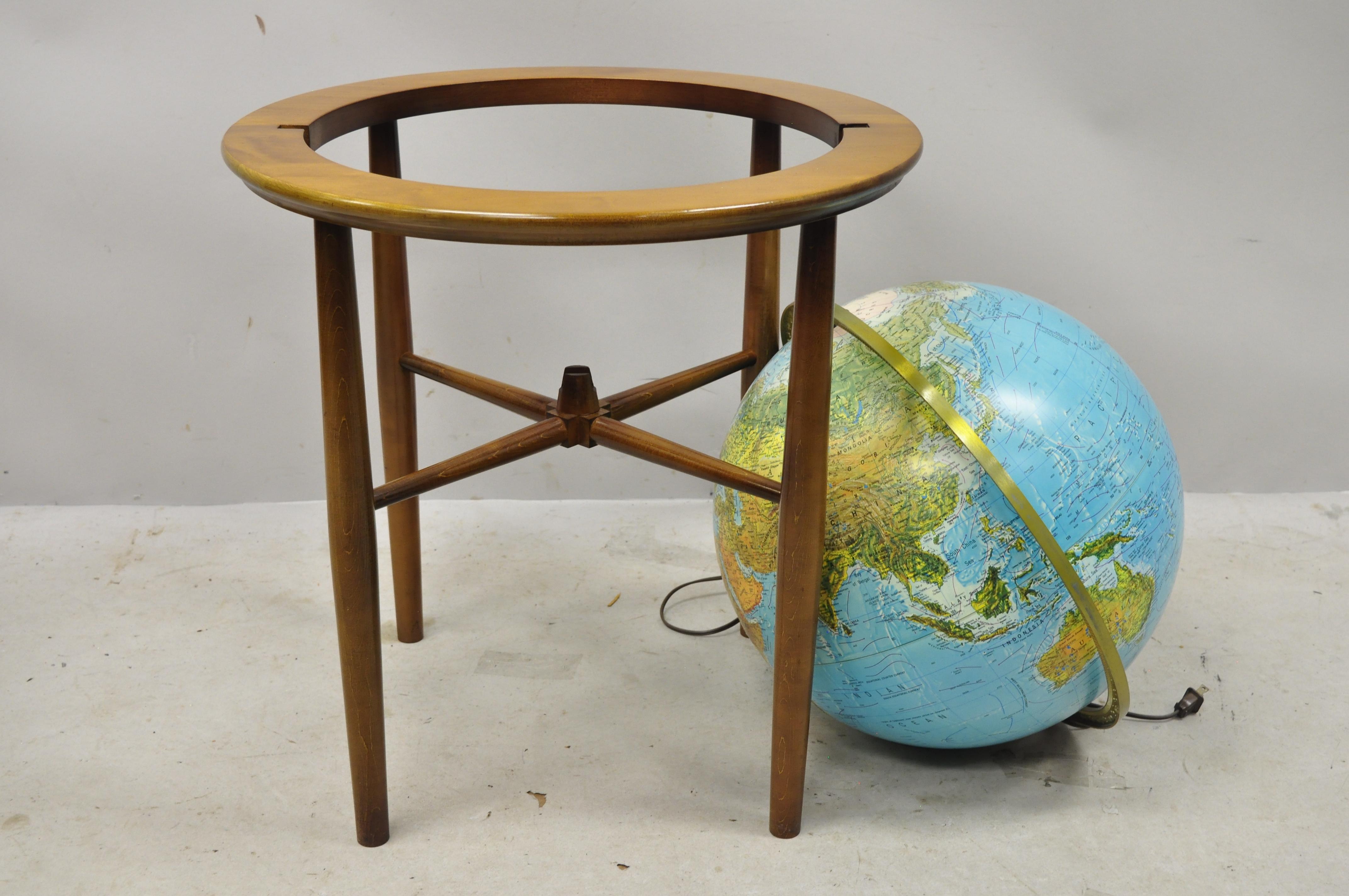lighted globe on wood stand
