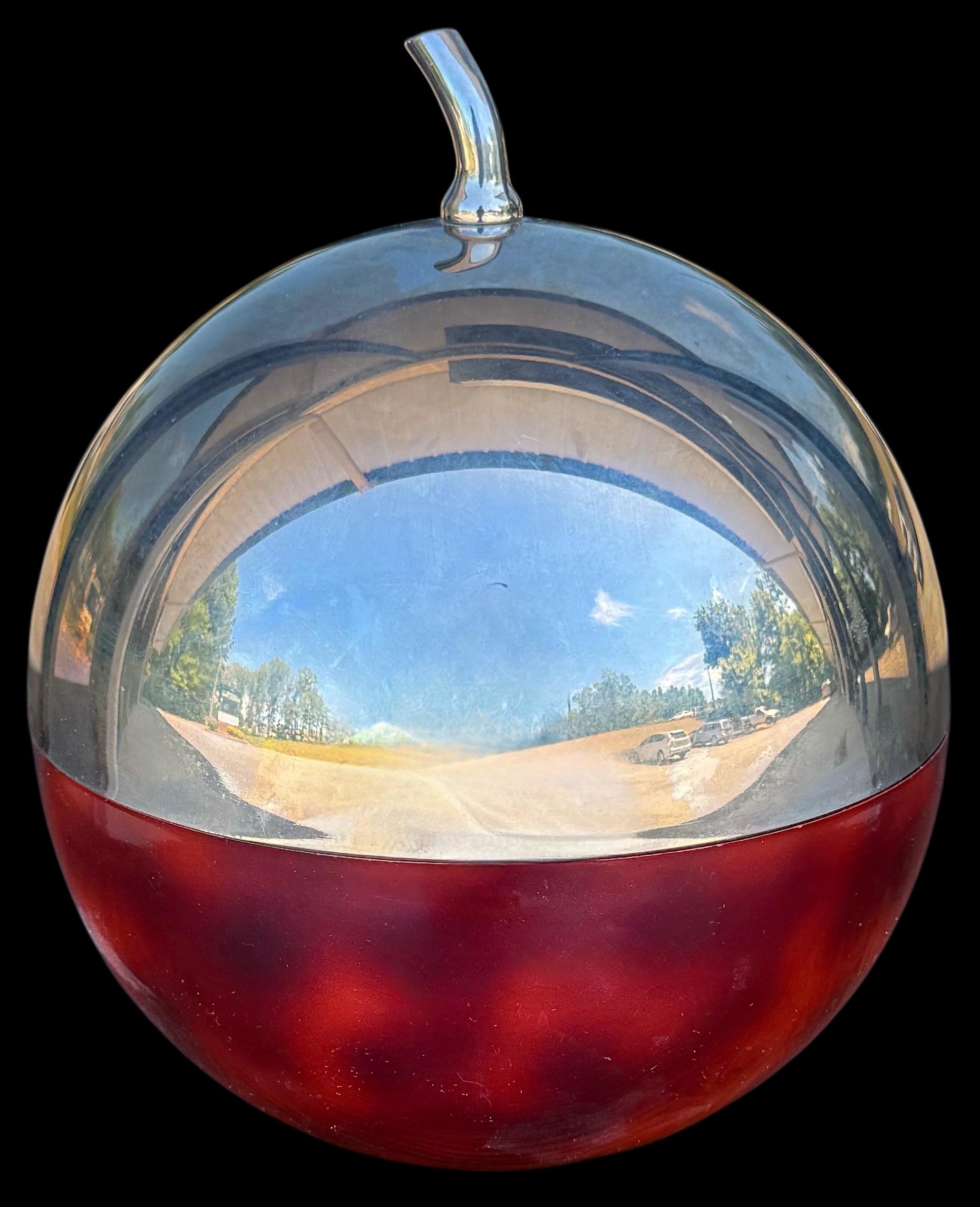 This is a fun cherry form ice bucket by Hans Turnwald in the 70s and produced in Germany and sometimes England. It is an excellent example of barware created with the space age trends of the day in mind. This one was created for Coldylux. 