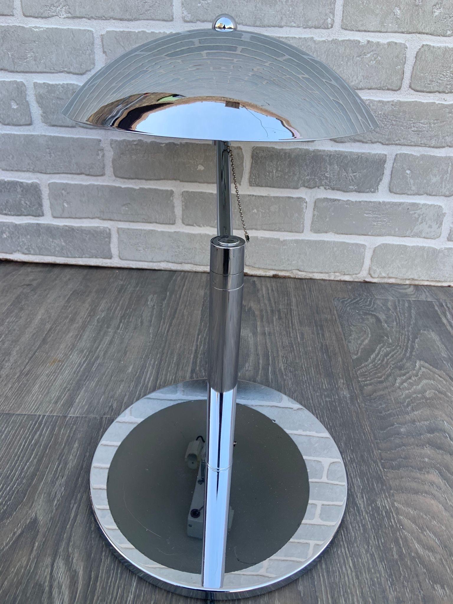 Mid-Century Modern Retro Swiss chrome plated flying saucer table lamps - pair

These mid century table lamps have a beautiful design!

