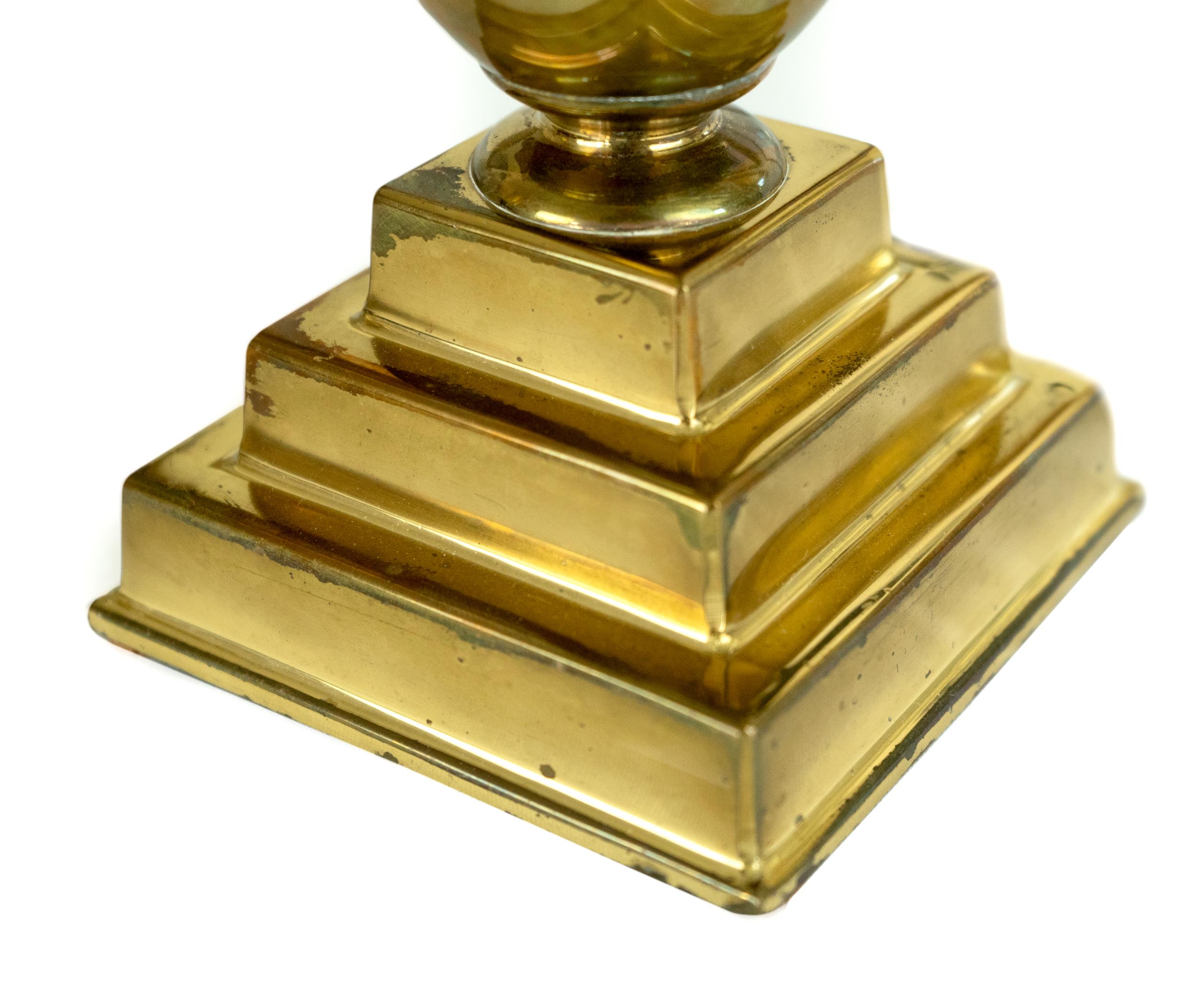 Pair of beautiful Mid-Century Modern trumpet shaped brass faces on stair stepped brass bases.