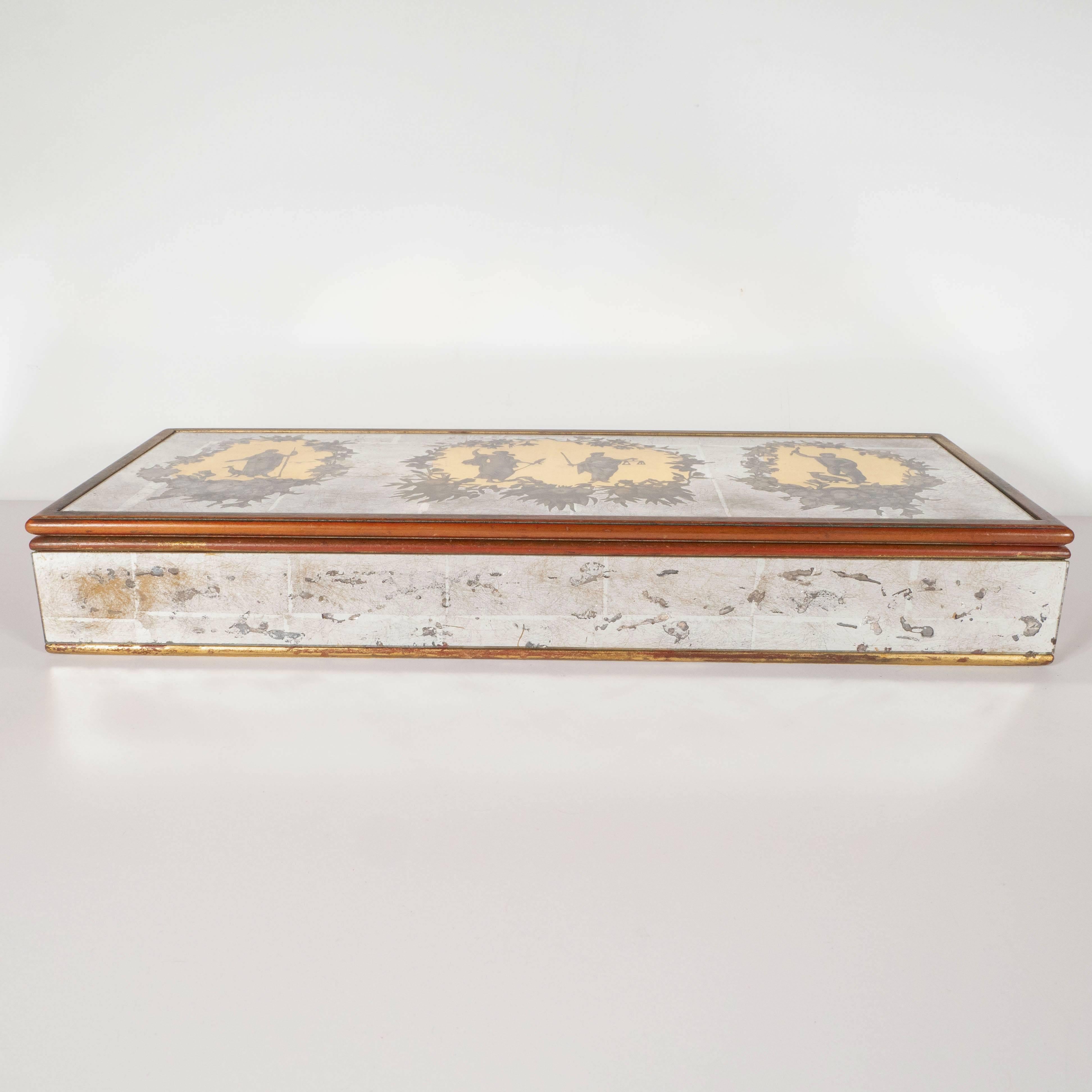 This stunning Mid-Century Modern Reverse Eglomisé white and yellow gold mirrored box was realized by the fabled Italian artist Piero Fornasetti. The piece features a giltwood frame with a white gold body. The top is adorned with neoclassical figures