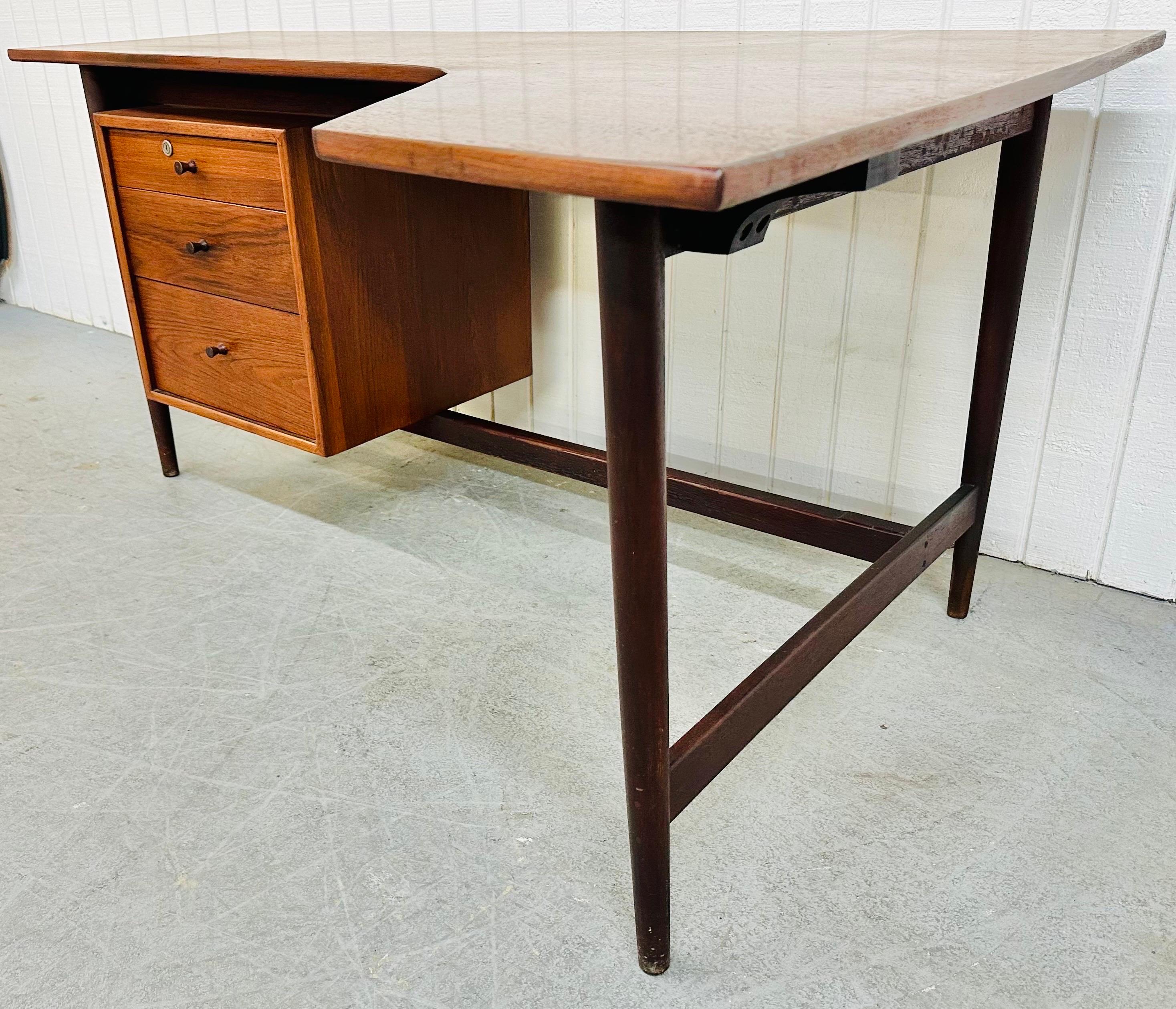 This listing is for an extremely rare Mid-Century Modern Richard Artschwager Walnut Studio Desk. Featuring a right corner boomerang style design, floating three drawer cabinet, four legs, original pulls, and a beautiful walnut finish. This is an