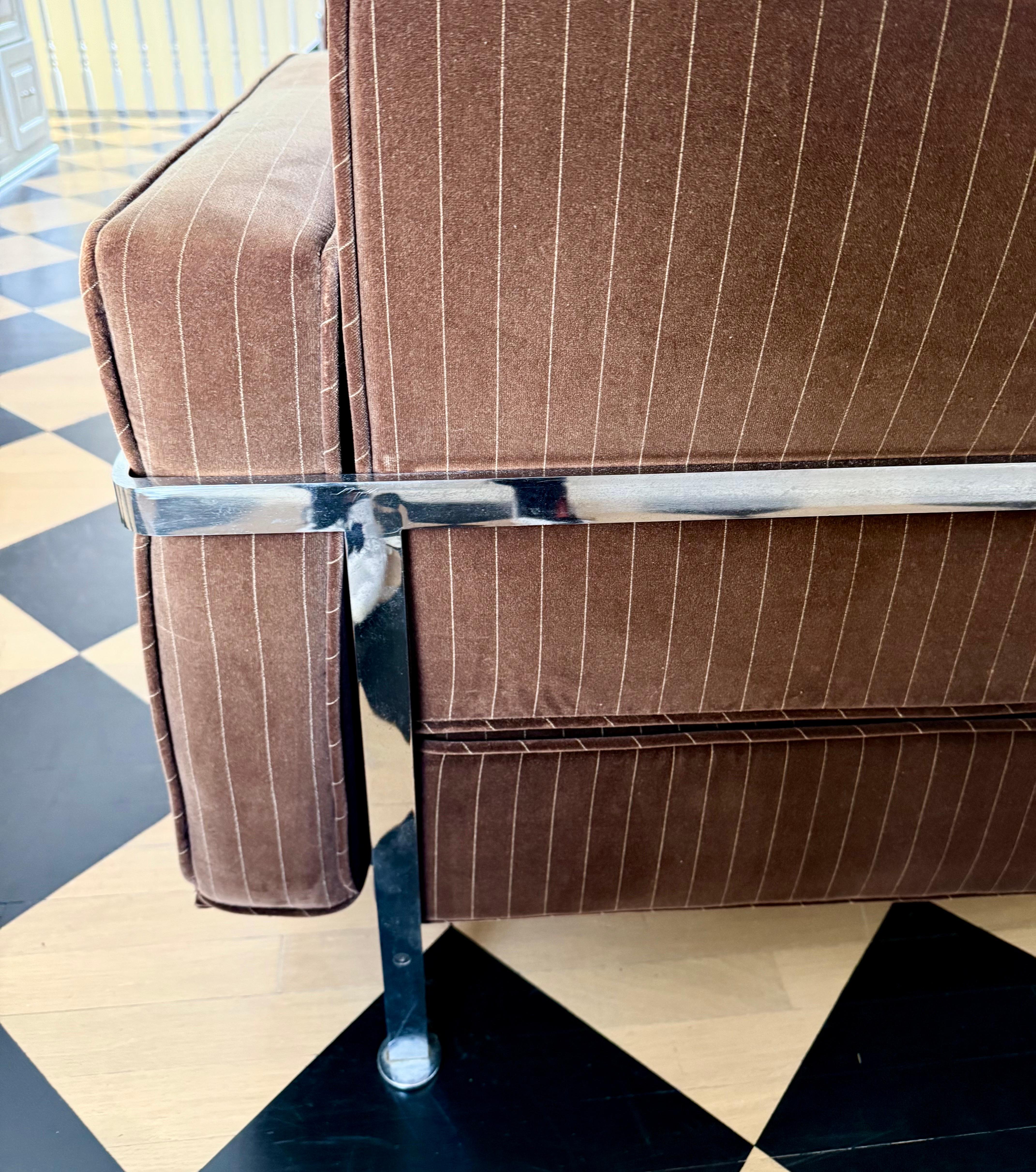 Robert Haussmann RH 302 3-seat sofa manufactured by Hans Kaufeld.
This sofa is the first early production for Hans Kaufeld and then later manufactured by De Sede.
Features elegant chocolate brown pinstripe velvet fabric which has slight sun fading