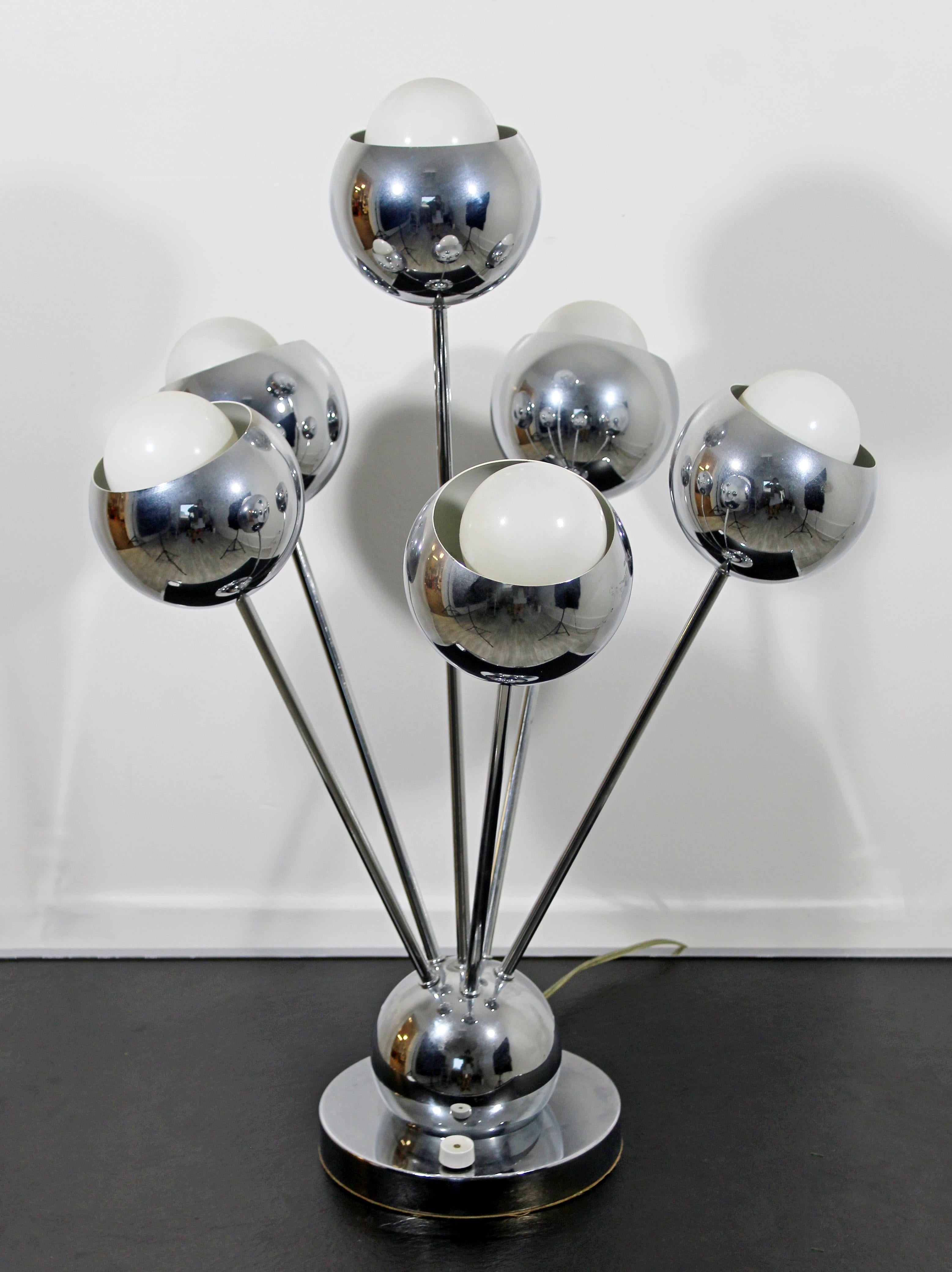 For your consideration is a stunning, Sputnik style six-arm, chrome table lamp, by Robert Sonneman, circa 1970s. In very good condition. The dimensions are 18