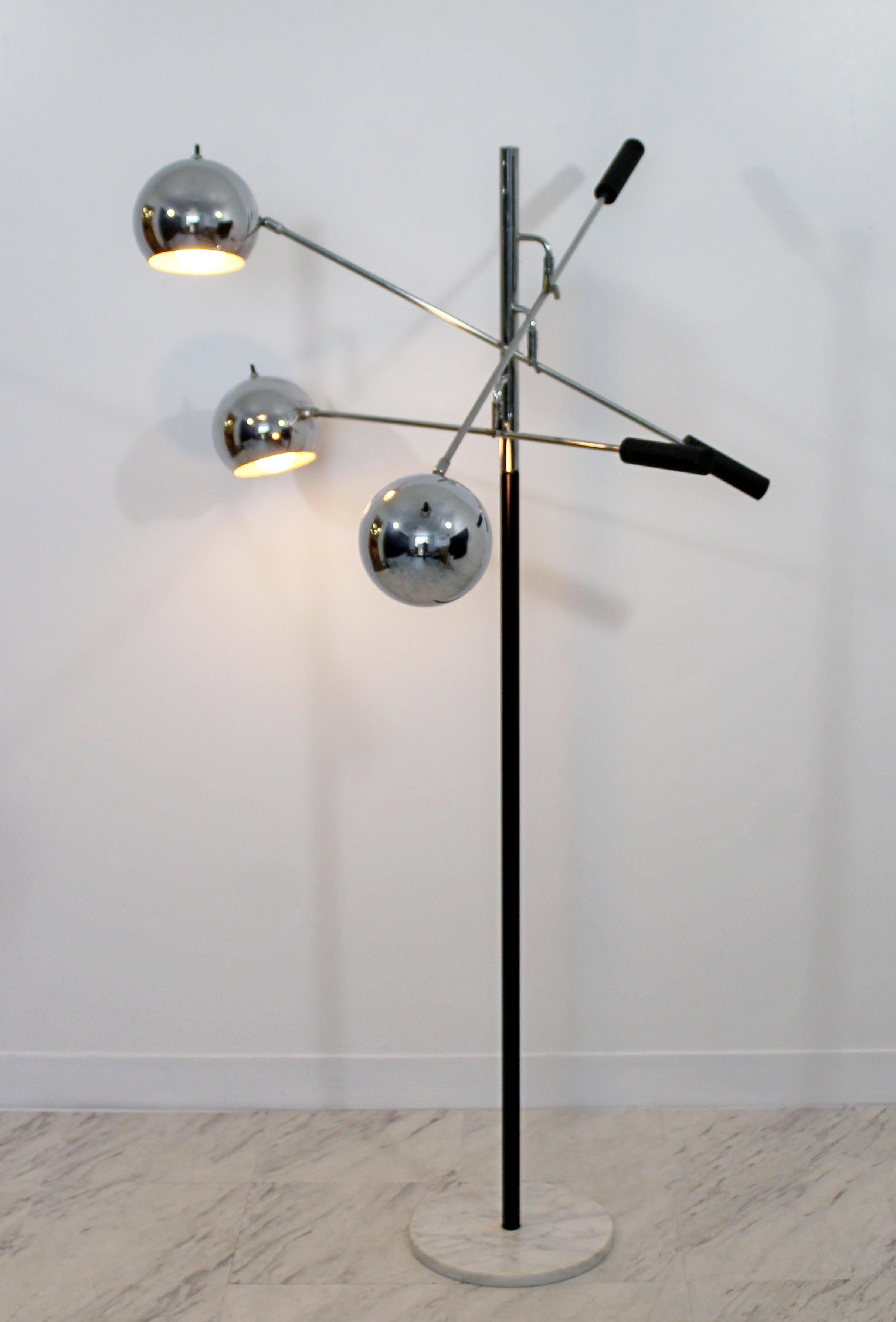 For your consideration is a fantastic floor lamp, with three adjustable chrome heads, on a white marble base, by Robert Sonneman, circa 1970s. In excellent condition. The dimensions are 34