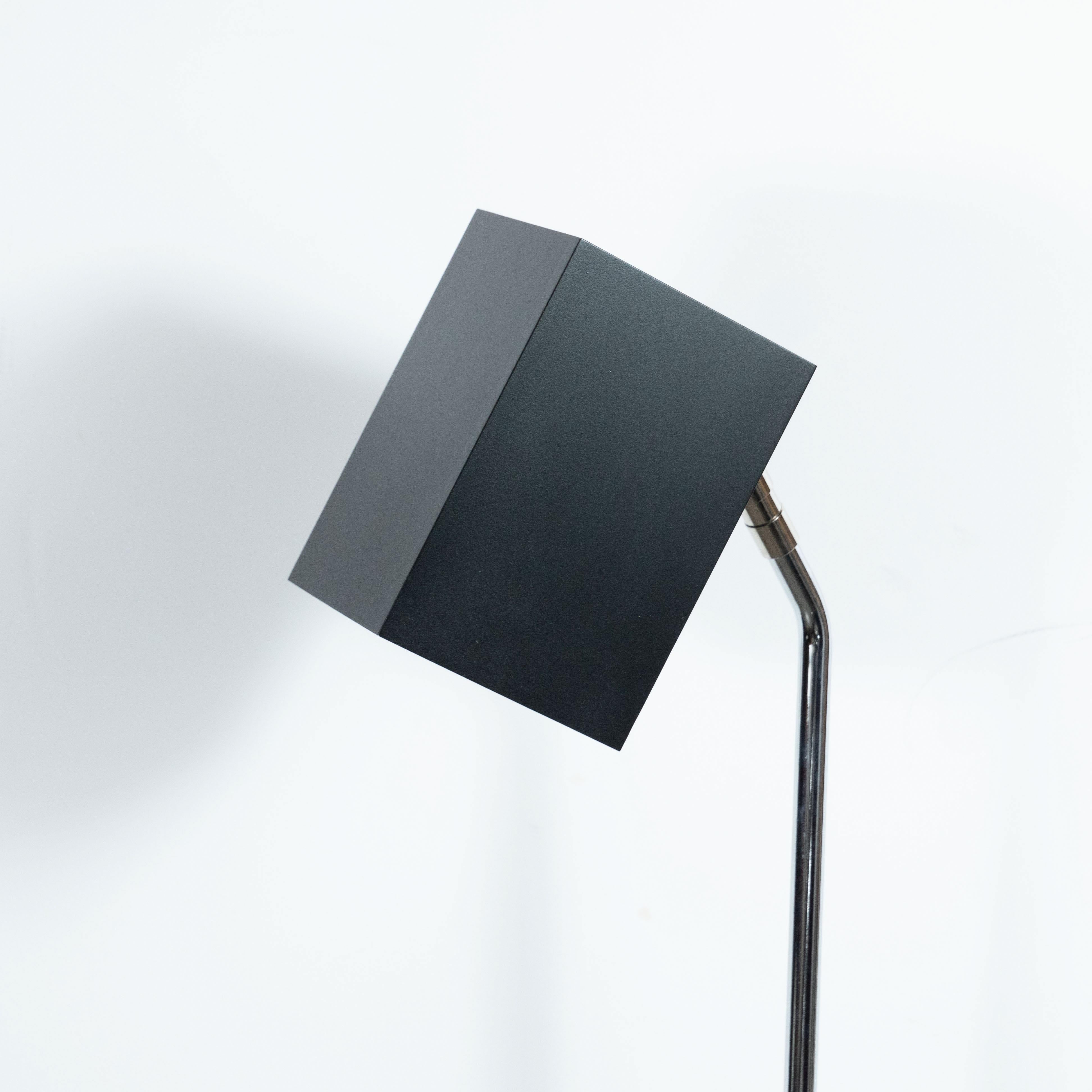 This sleek floor lamp was designed by Robert Sonneman for George Kovacs, circa 1970. Sonneman's innovative light fixtures are studies in movement, weight, and balance. His designs are critically lauded and have been exhibited at the Museum of Modern