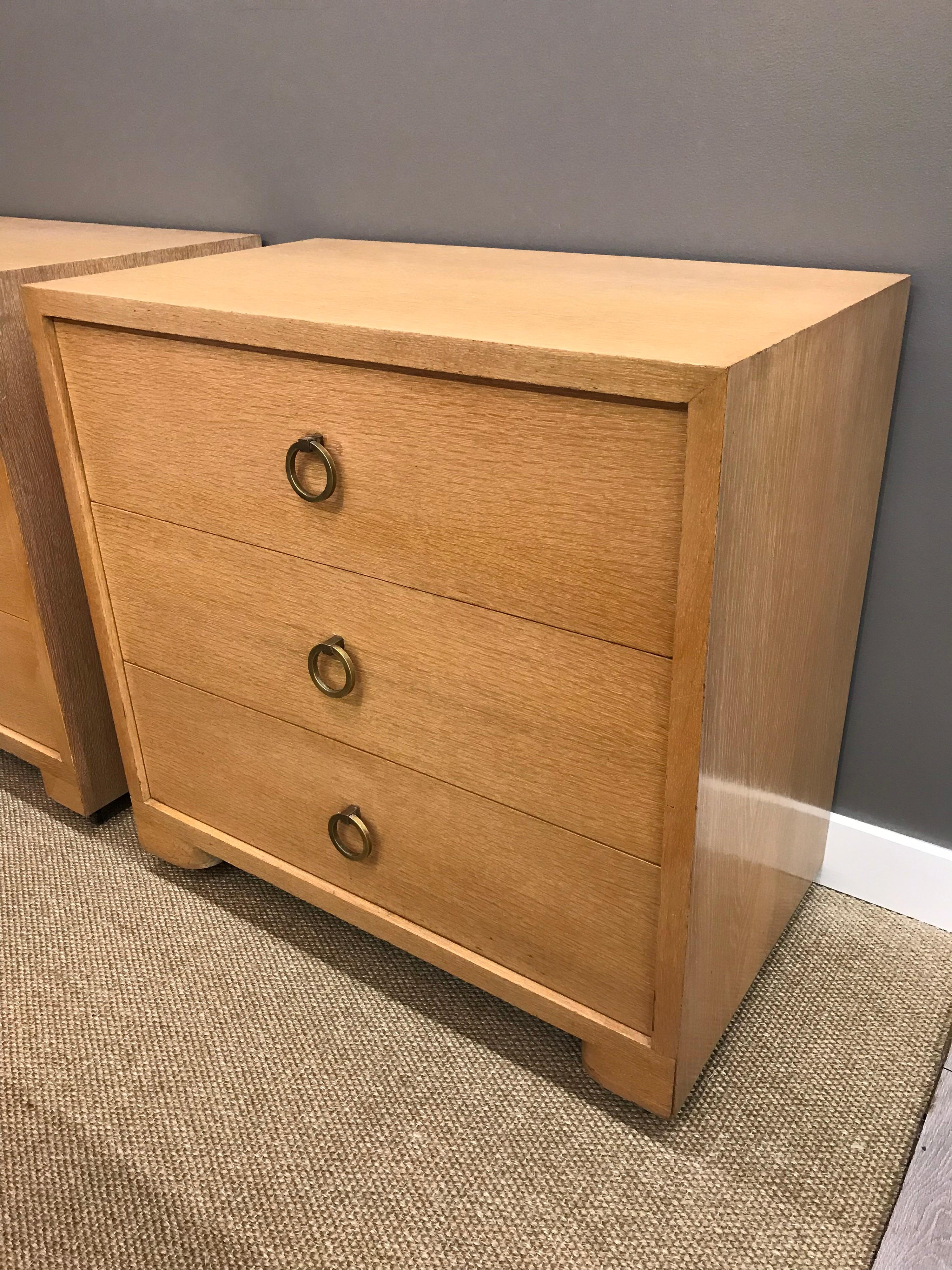 Birch and walnut small dressers on casters done in birch and walnut. They feature the Classic brass drawer pulls. Made by John Widdicomb in the 1950s. No manufacturer hallmarks.