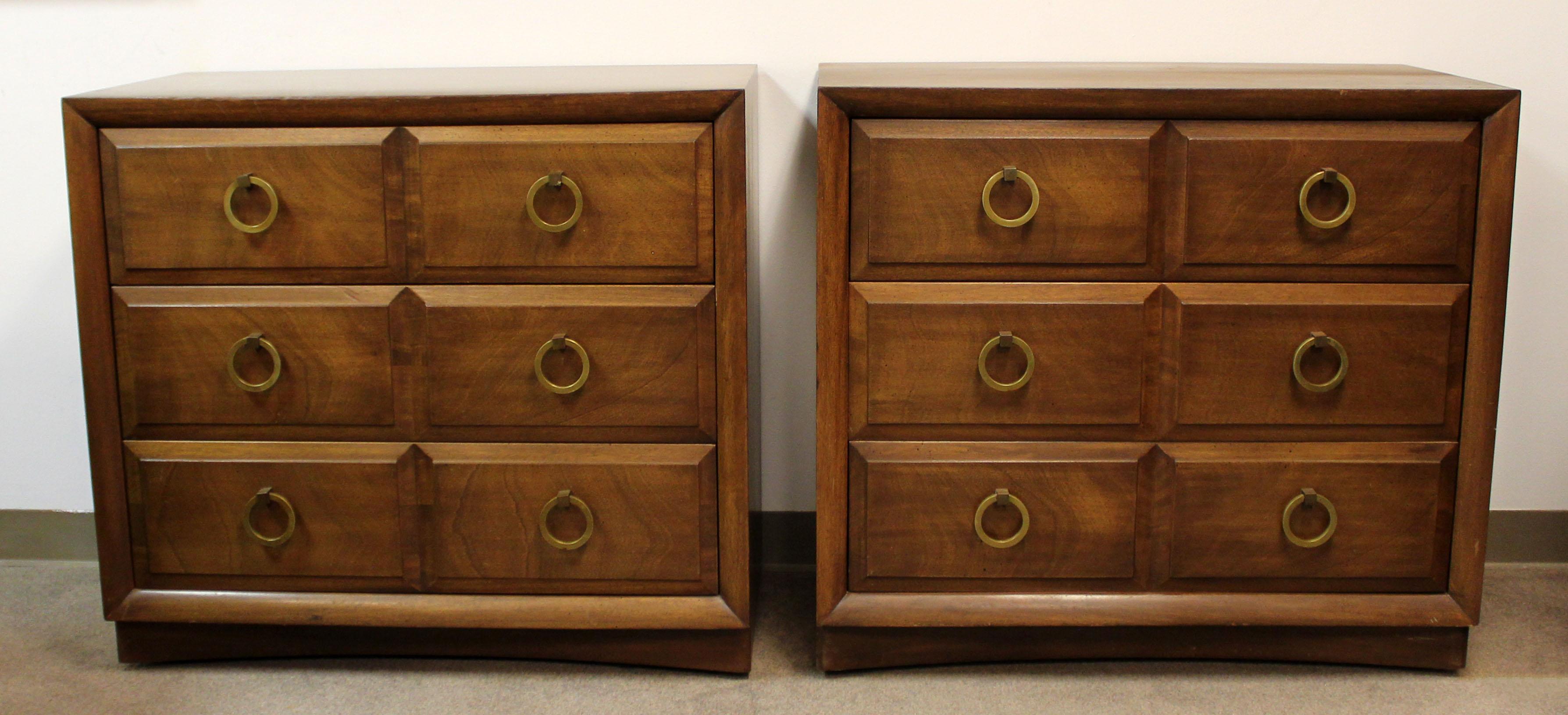 For your consideration is a wonderful pair of wooden dressers, with three drawers that have brass handles, by T.H. Robsjohn Gibbings, circa the 1950s. In excellent condition. The dimensions are 36