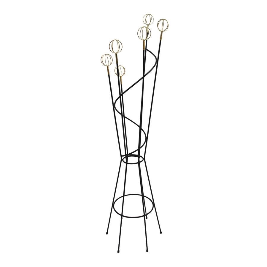 Coat stand designed by Roger Feraud and edited by Geo, composed of six arms made of black lacquered iron finished in brass spheres, France, 1950.