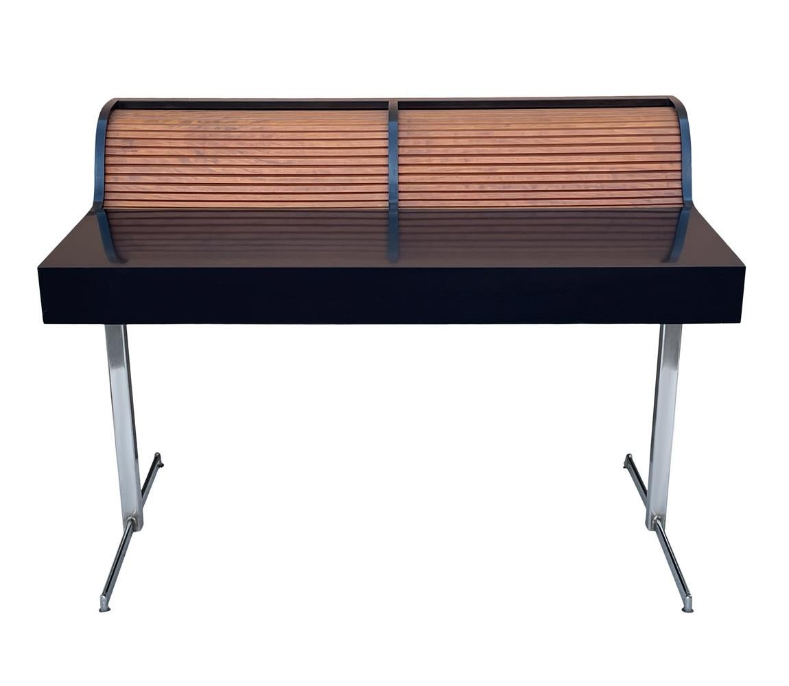 A sleek classic looking mid century roll top desk. Great interior storage for books and pencil tray.