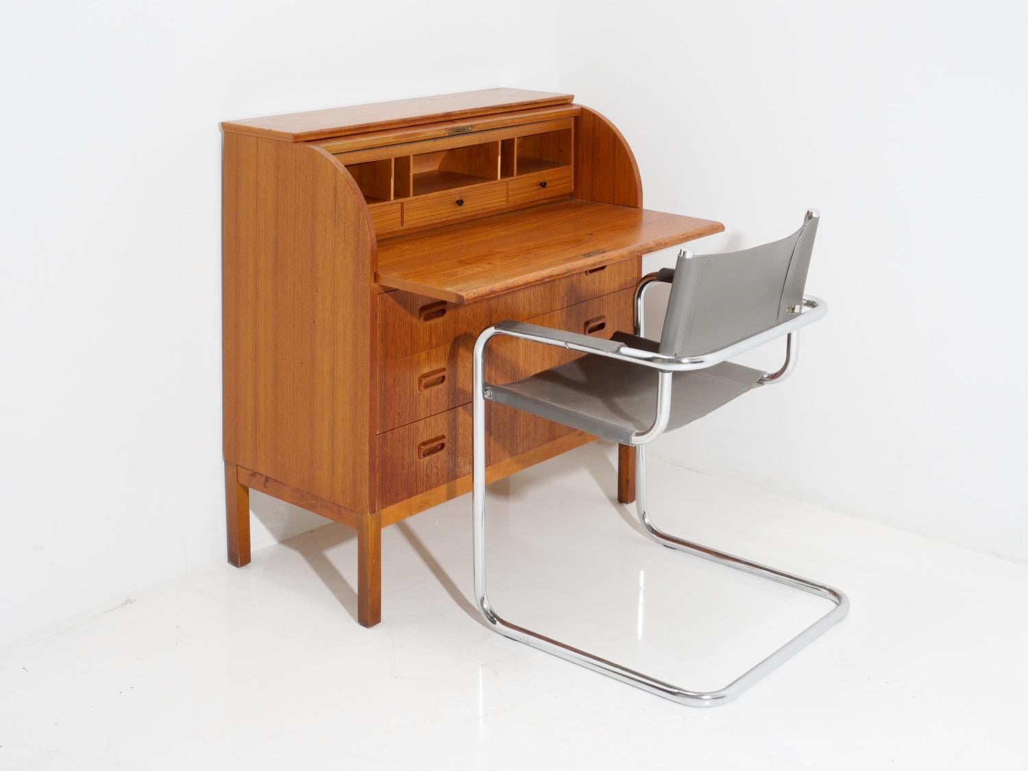 If you want to feel like a classy, old-school boss while working from home in your sweatpants, a vintage teak roll top secretary desk is the way to go. You can even pretend you're in a 1920s detective movie and dramatically roll up the top whenever