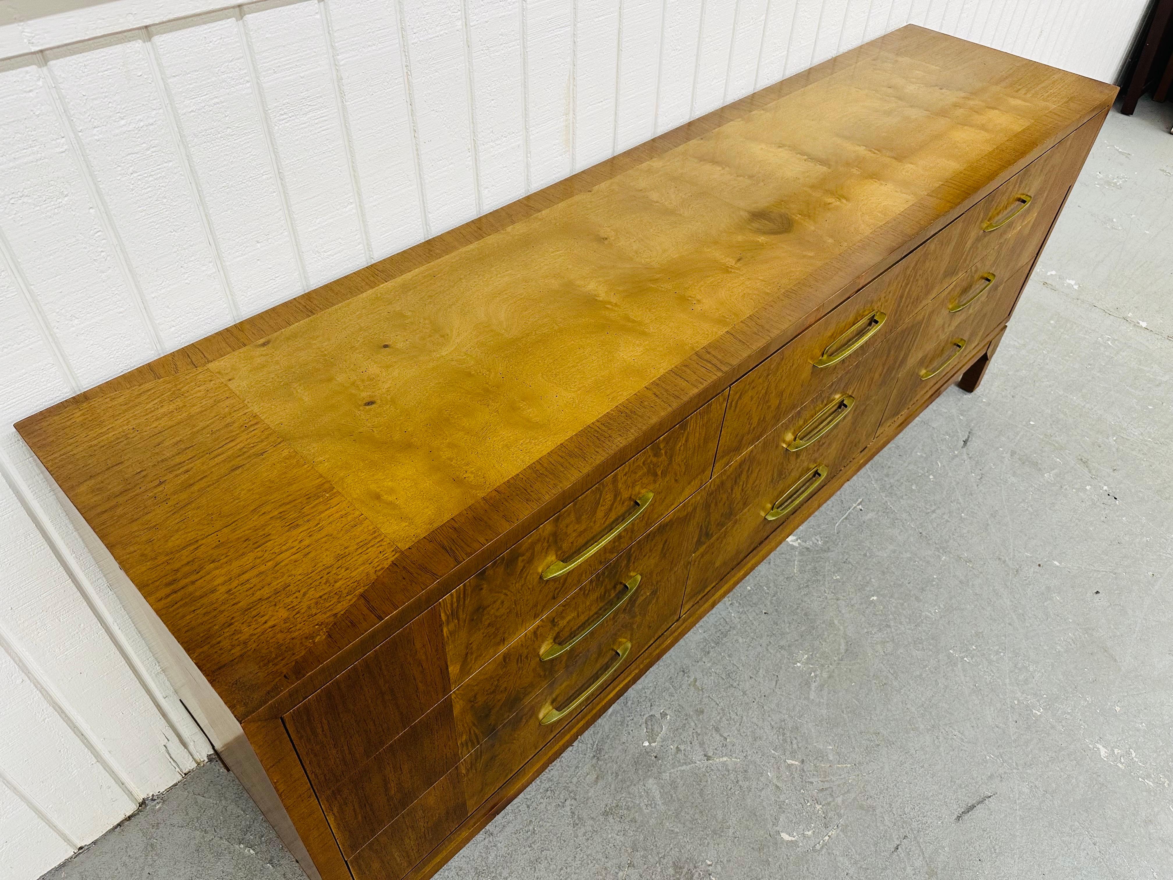 This listing is for a Mid-Century Modern Rom Weber Burled Wood 9-Drawer Dresser. Featuring a straight line design, nine large drawers for storage, modern legs, brass pulls, and a beautiful burled wood finish. This is an exceptional combination of