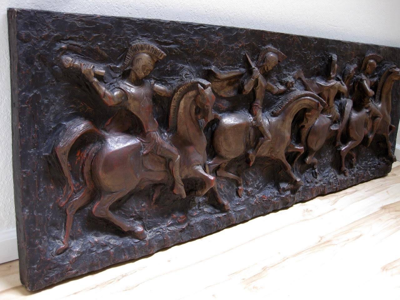 Mid-Century Modern three-dimensional molded fiberglass form of Roman gladiator soldiers on horseback. Finished in a painted bronze finish. Signed 