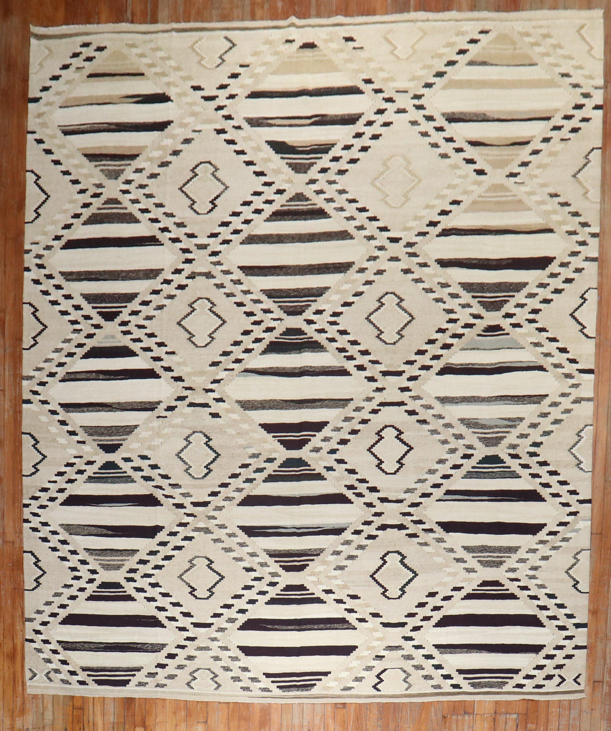 Late 20th-century geometric kilim in brown, ivory and camel tones

Measures: 10'1'' x 14'.