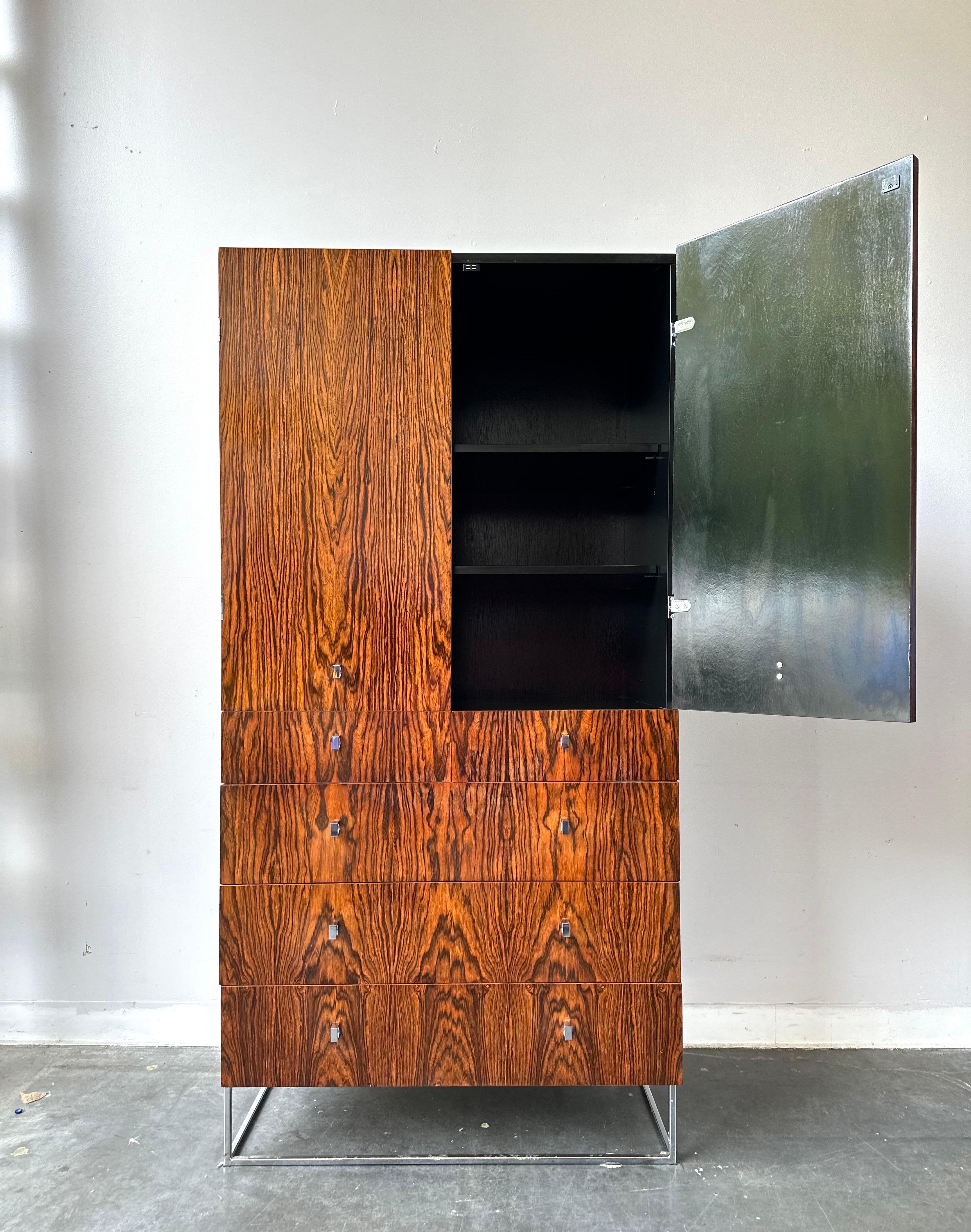 Stunning piece deigned by Roger Rougier circa 1970 Canada.

Rosewood front with black lacquer sides and inside.
Featuring chrome pulls and loads of storage space.

This piece had minor signs of wear and is ready for use.

Dimensions:

32” W x 20” D