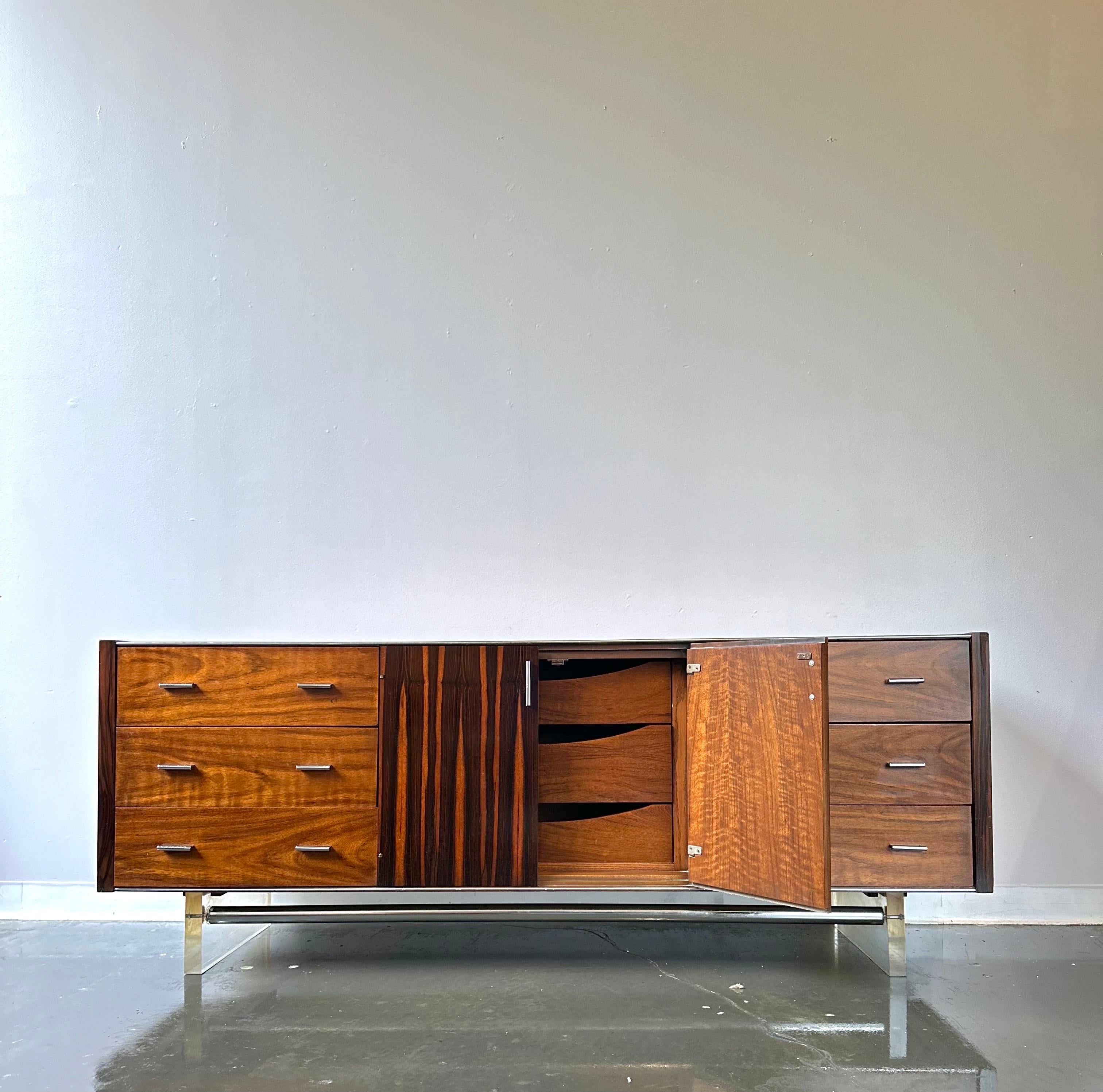 Stunning Rosewood & Walnut low dresser with lucite and chrome low nine drawer dresser or credenza

Made by Modernage furniture circa 1960.

this is truly a rare piece of mcm.   it presents very well and is all original with a freshly refinished top.