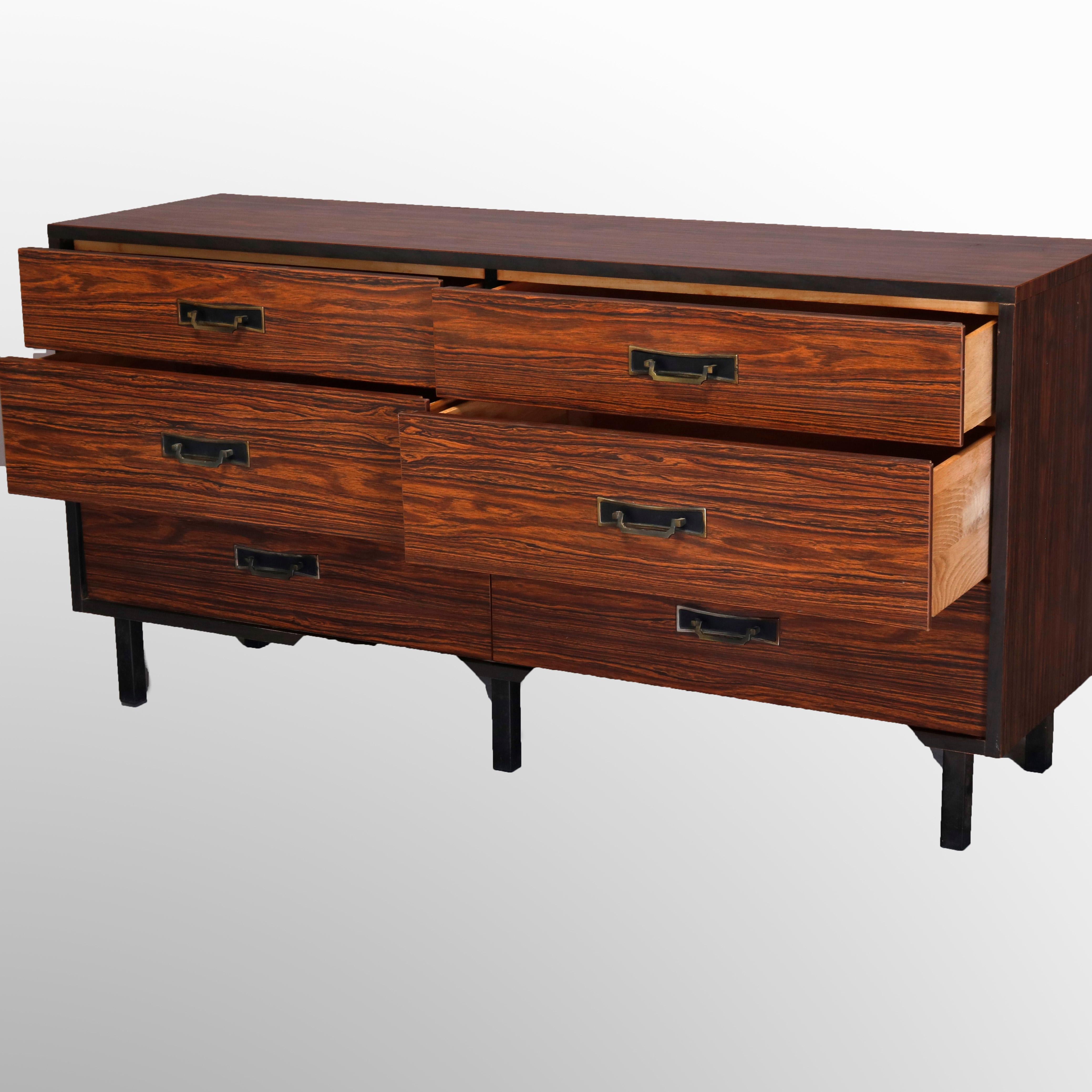 A Mid-Century Modern dresser offers rosewood construction with six drawers raised on straight and square legs, 20th century

Measures - 30'' H x 60.25'' W x 17.5'' D.