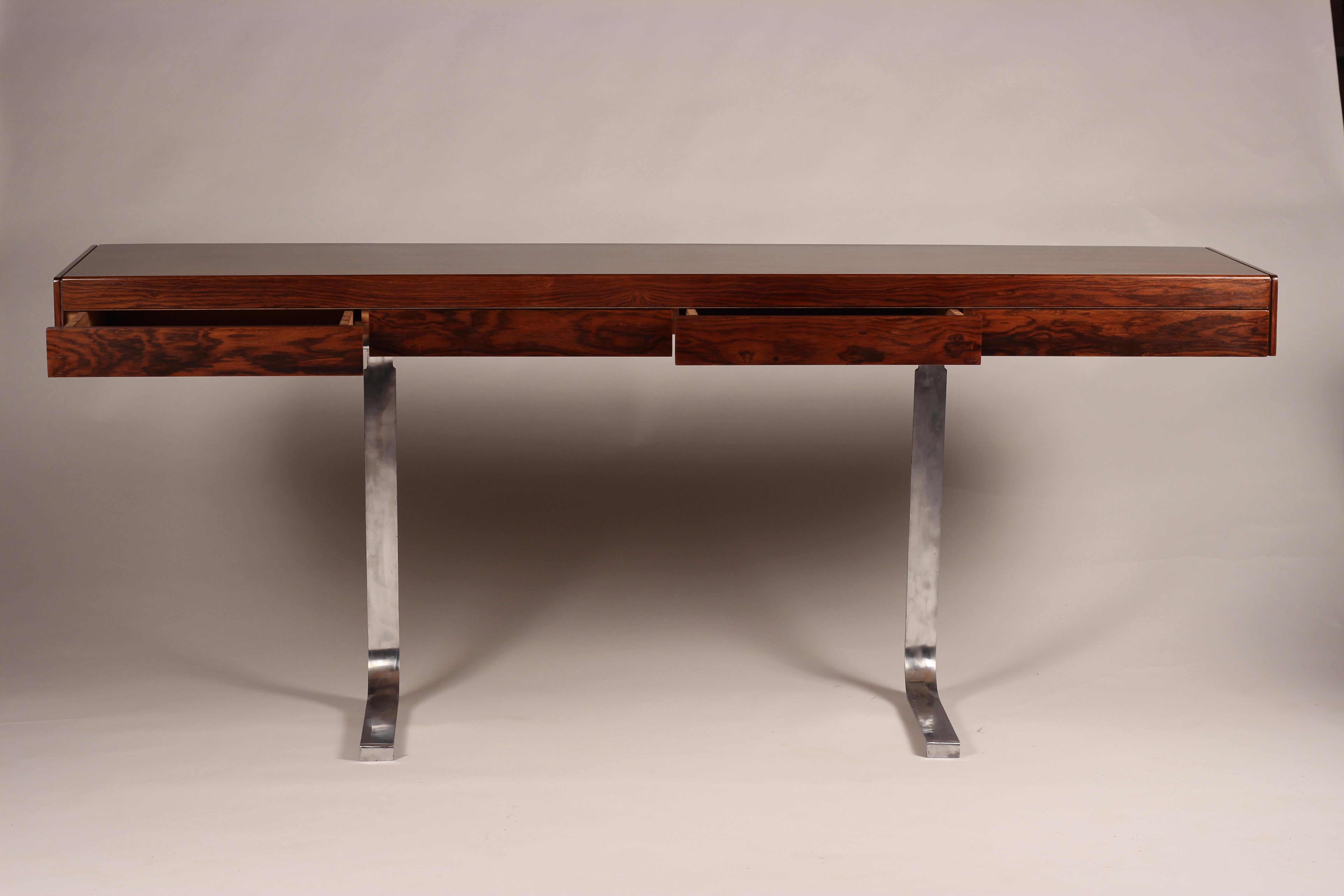 Mid-Century Modern British design by the successful duo of designer Robert Heritage and maker Archie Shine. Purchased at Harrodsburg in the late 1960s this piece could be used for a console table or desk with hidden drawers. Four Beautifully book