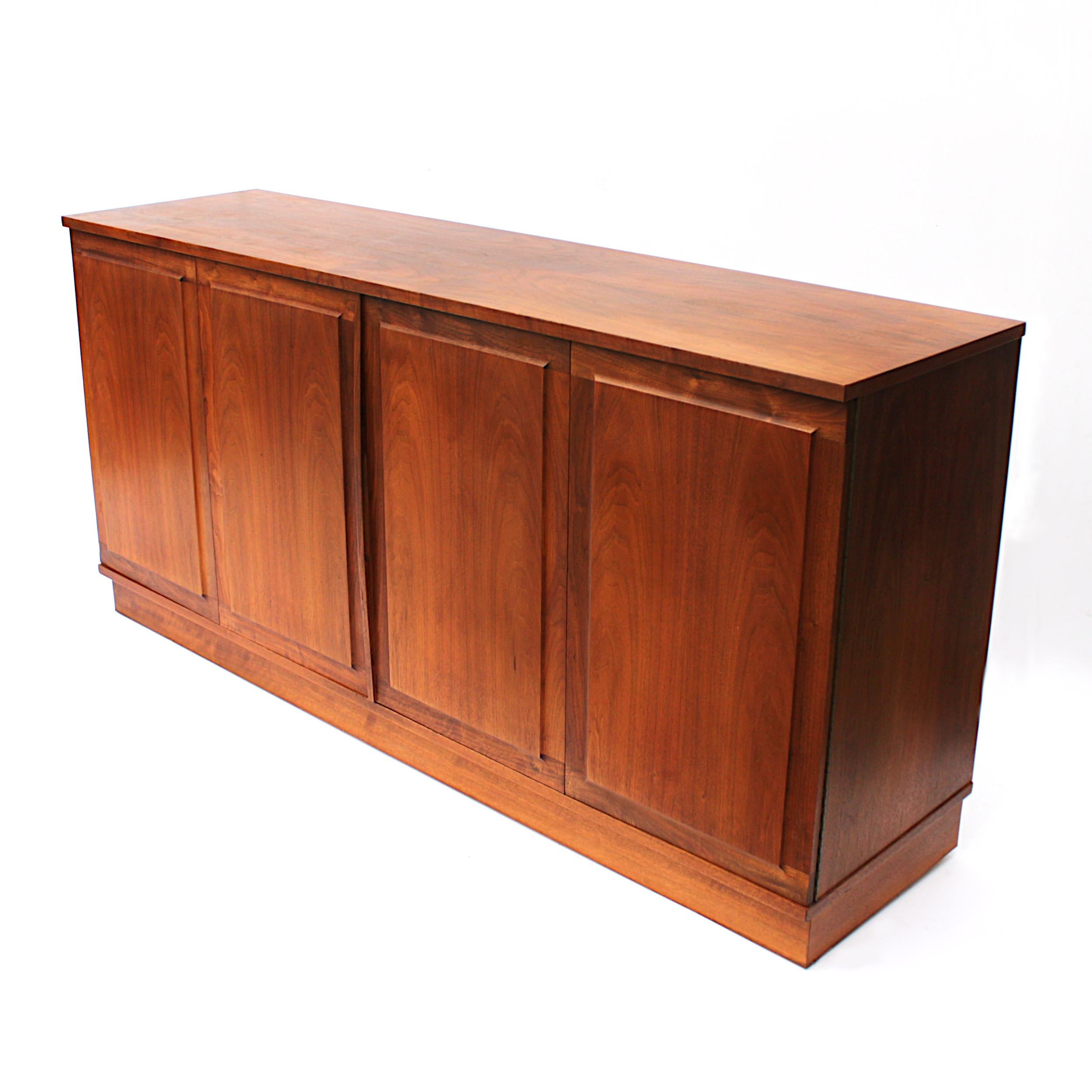 Beautiful Honduran rosewood Credenza by Jack Cartwright for Founders. Credenza features unique accordion-style doors, lots of storage, and is capable of accommodating up to a 77