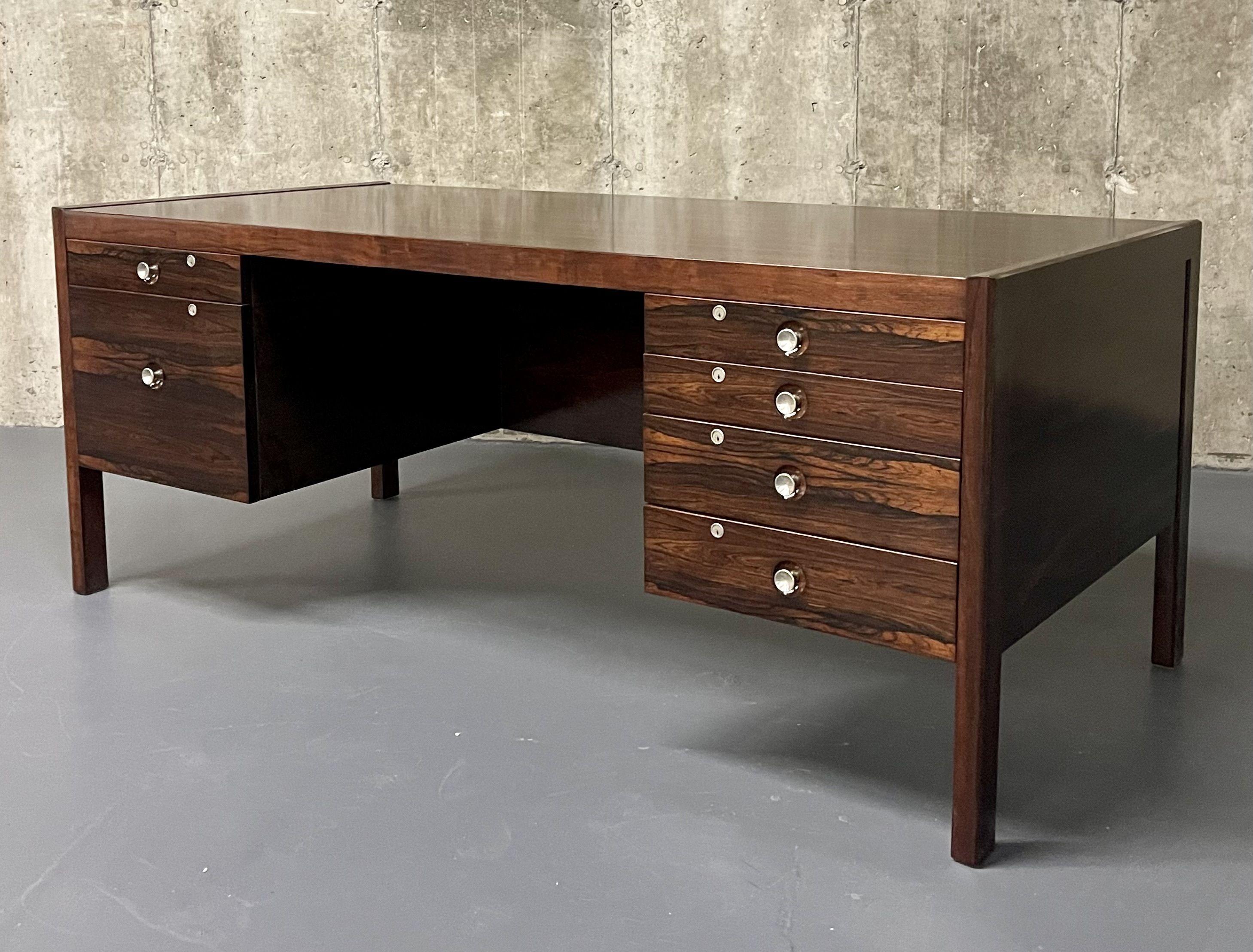 Mid-Century Modern Rosewood Knee Hole Desk, Writing Table, Chrome Accents, Refinished, Danish, Finn Juhl Style

A large and impressive Finn Juhl Style solid Rosewood desk having recently been finely finished. This spectacular desk is simply stunning