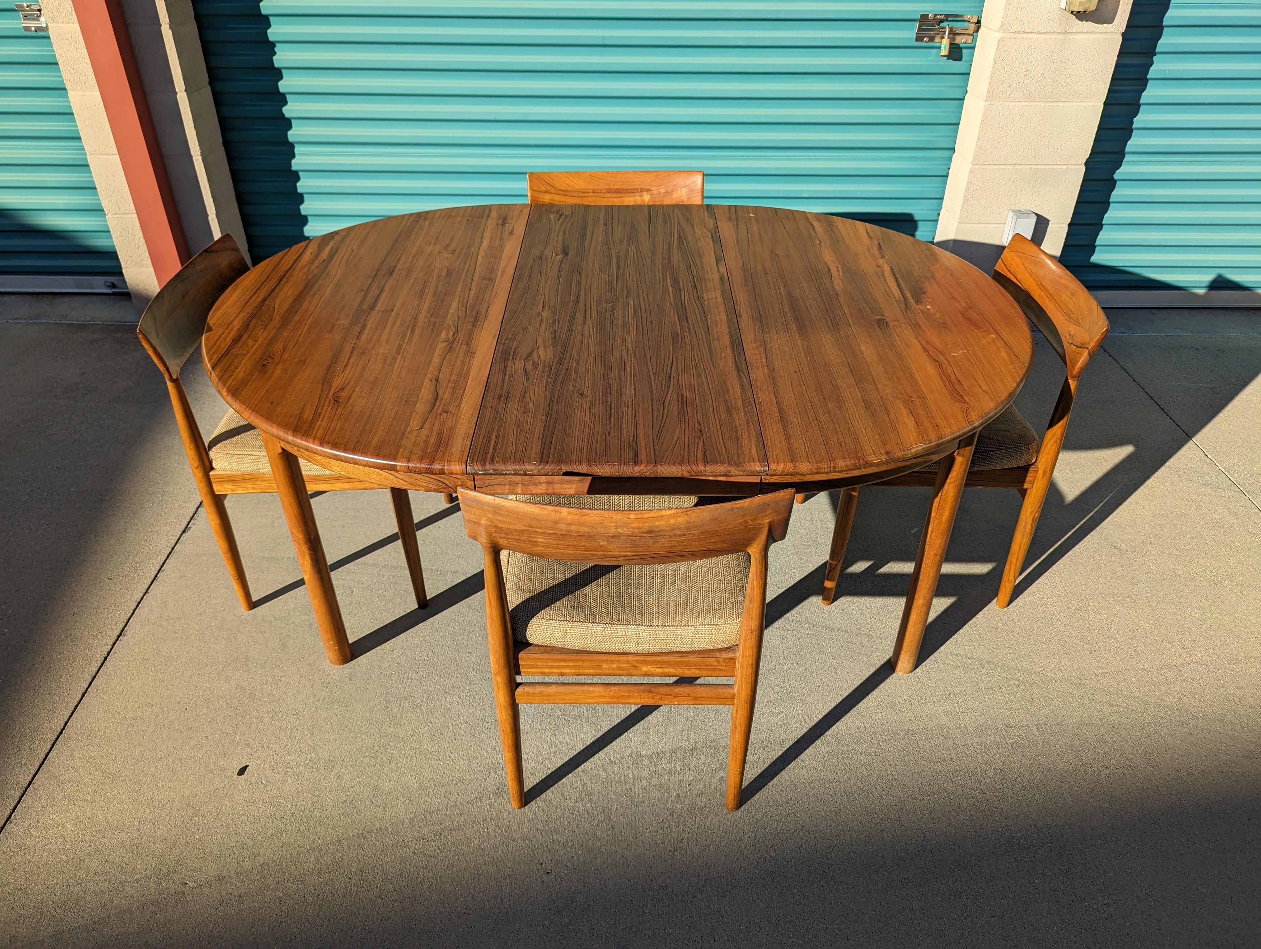 Delve into the elegance of the past with this exquisite vintage mid-century modern rosewood dining set. Inspired by timeless Danish design and crafted with care in the Philippines, this ensemble is a unique fusion of global aesthetics and