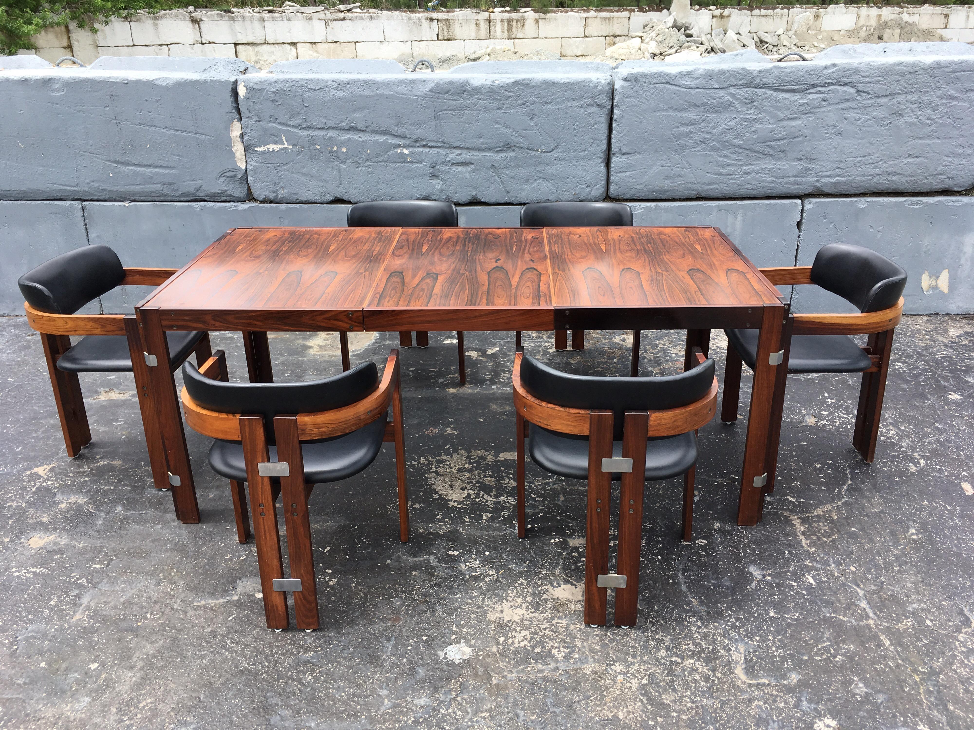 Beautiful rosewood dining table, partly solid and veneered. Table has one leaf, without leaf table is 53.25” wide.
Please see all the nice design details of the table.



 