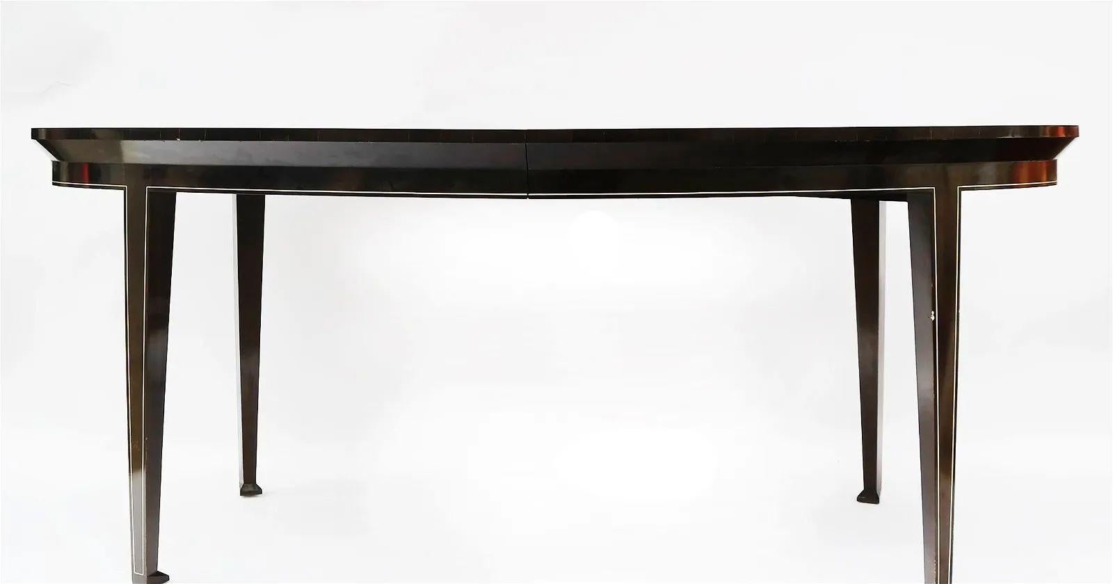 Mid-Century Modern Rosewood & Ebony Dining Table, Dunbar, French Art Deco Style

A finely refinished rosewood and ebony dining table with an all around faux ivory inlay set upon an ebony base. Simply stunning.  This must have mid century modern