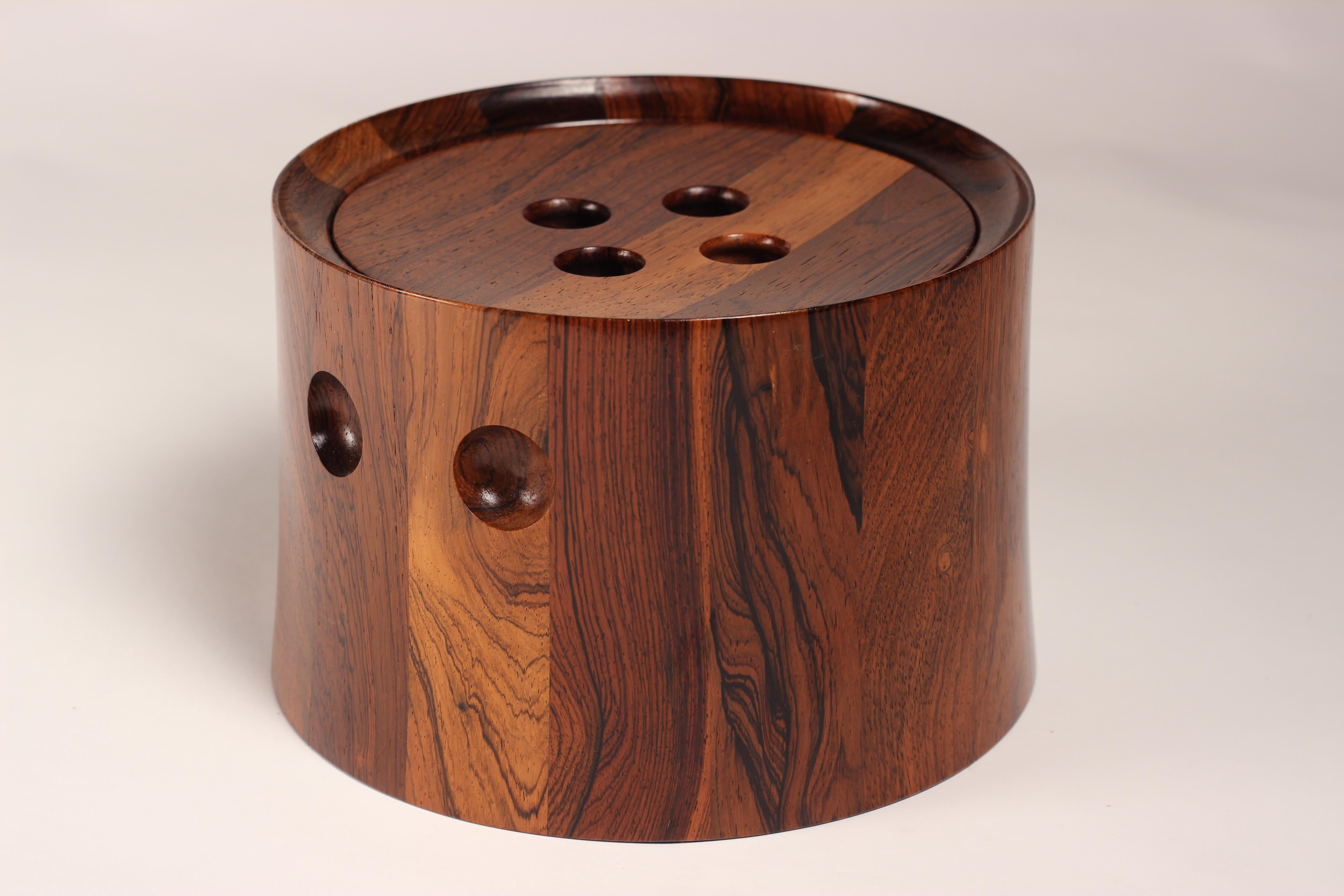 Scandinavian Modern rosewood ice bucket designed by Jens Quistgaard a master of sculptural paired back and beautifully simplistic forms. This rosewood ice bucket has had its wood sympathetically and selectively chosen in order to create an