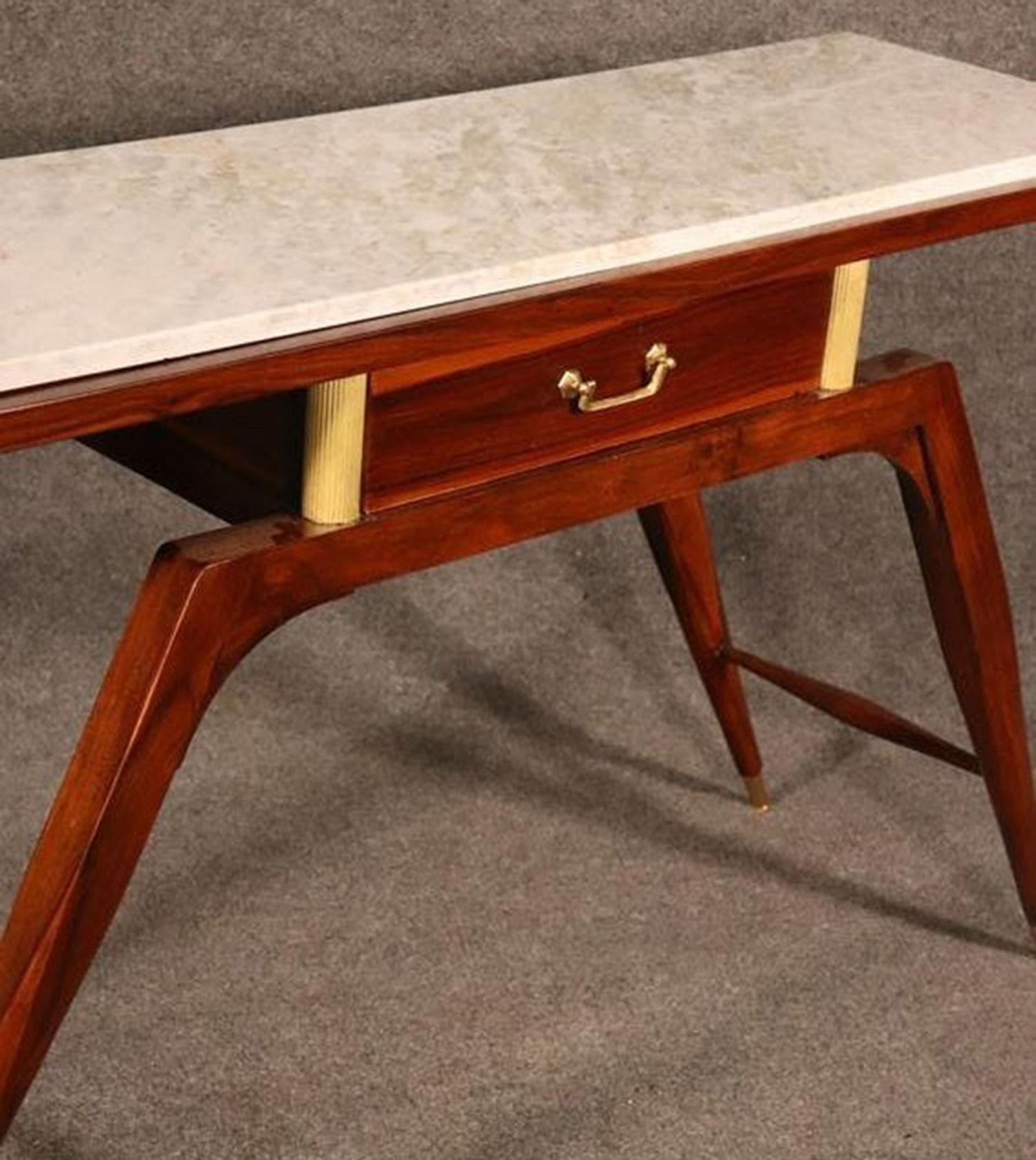 This a gorgeous table. Look at the marble top and super-sleek lines, circa 1950. Measures: 52 wide x 32 tall x 16 deep beautiful conditions no damage to the marble top.