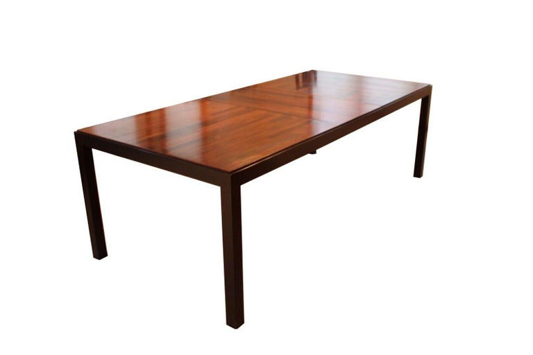 Le Shoppe Too presents this beautiful rosewood parsons dining table with 2 additional leafs. In very good condition Dimensions: 67.5