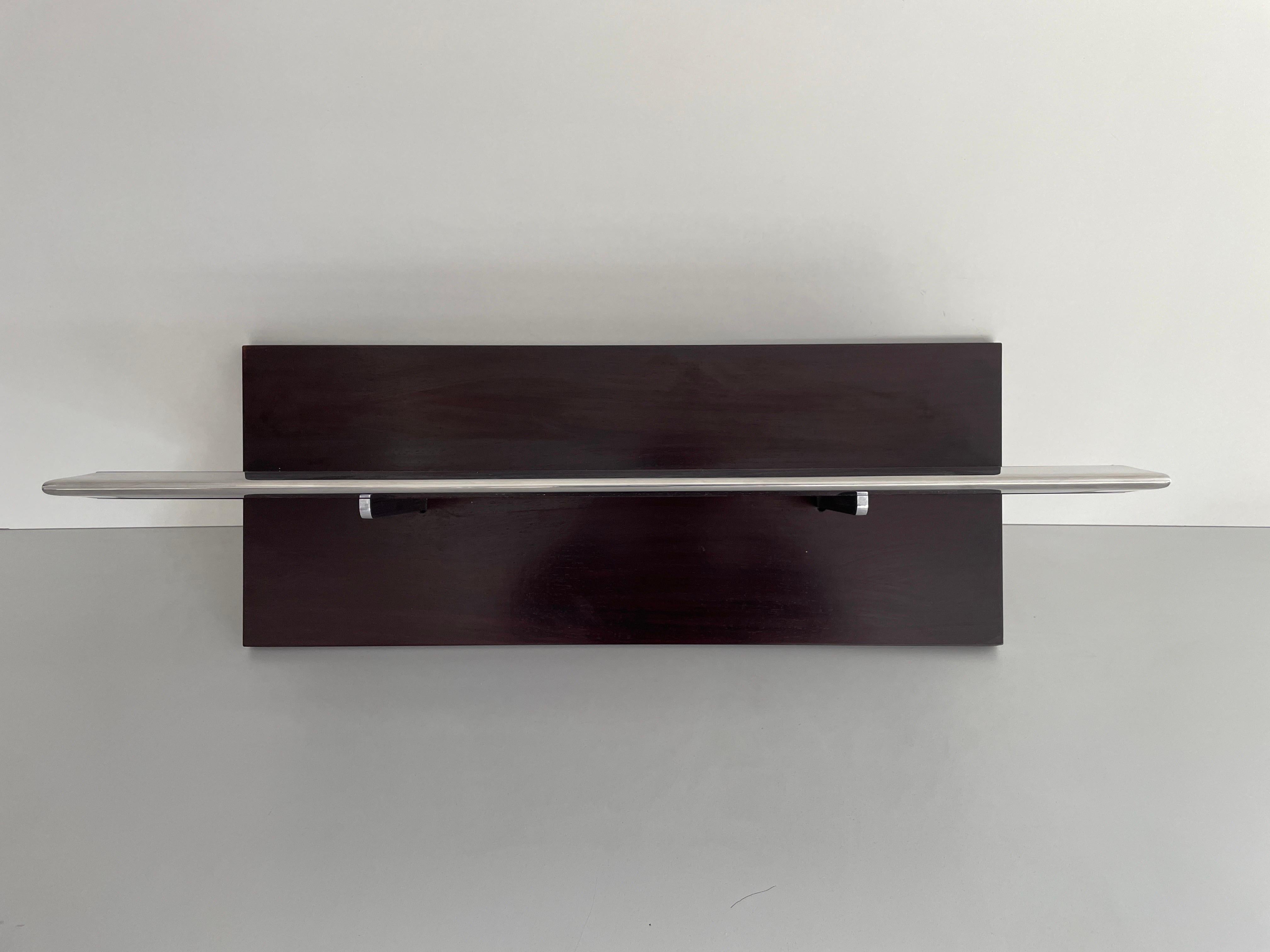 Mid-century Modern Rosewood Shelf with Steel Cover by Saporiti, 1960s, Italy

No damage, no crack.
Wear consistent with age and use.

Measurements: 
Height: 32 cm
Width: 70 cm
Depth: 28 cm