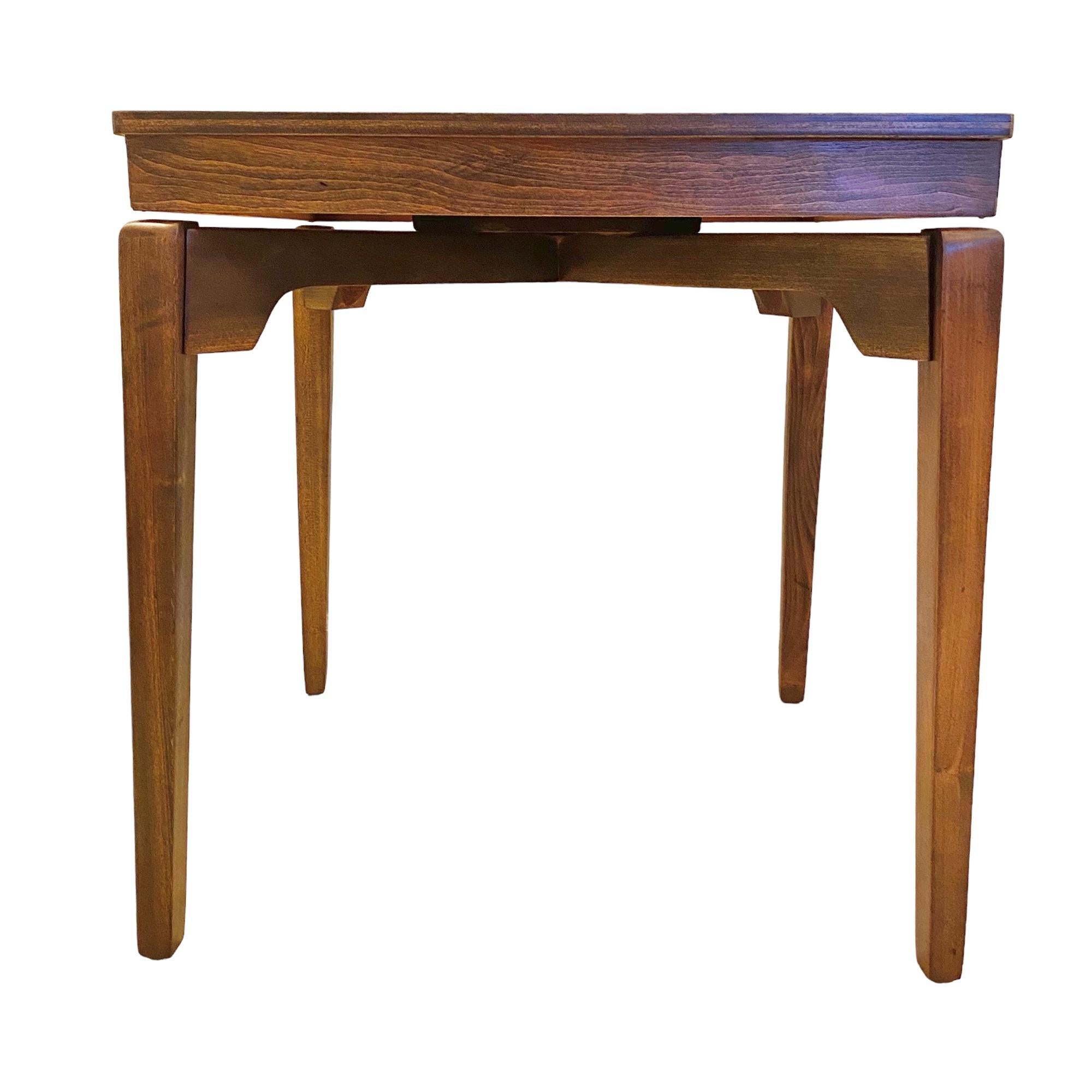 A vintage mid-century modern hardwood tall accent table with a 360 degree rotating top and squared tapered legs. A 1950's design manufactured by Universal Woodcrafters Inc. of La Porte, Indiana.

Please note: The table will be shipped with the legs