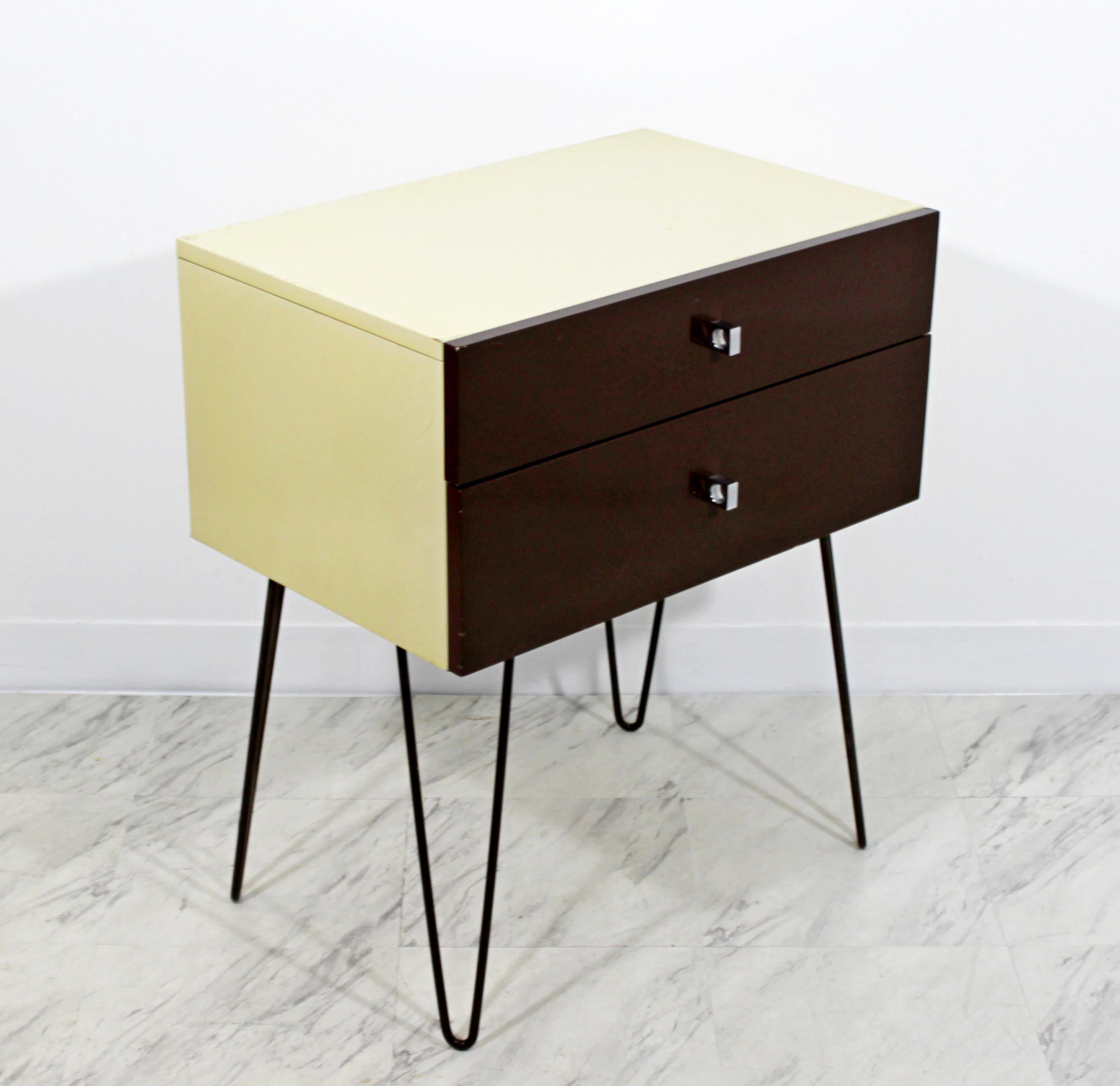 For your consideration is an original side or end table, with two drawers that have chrome pulls, on hairpin legs, by Rougier, circa the 1960s. In good condition. The dimensions are 24