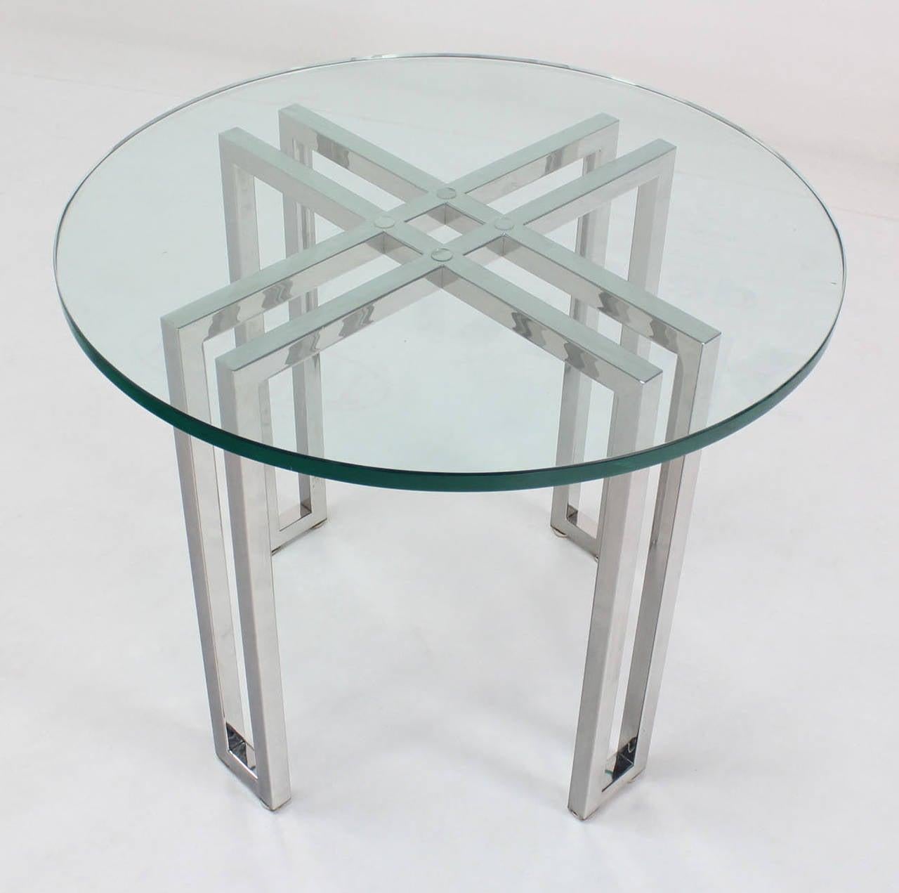 Quality studio made 3/4 inches thick glass top stand or side table on solid polished stainless steel base.